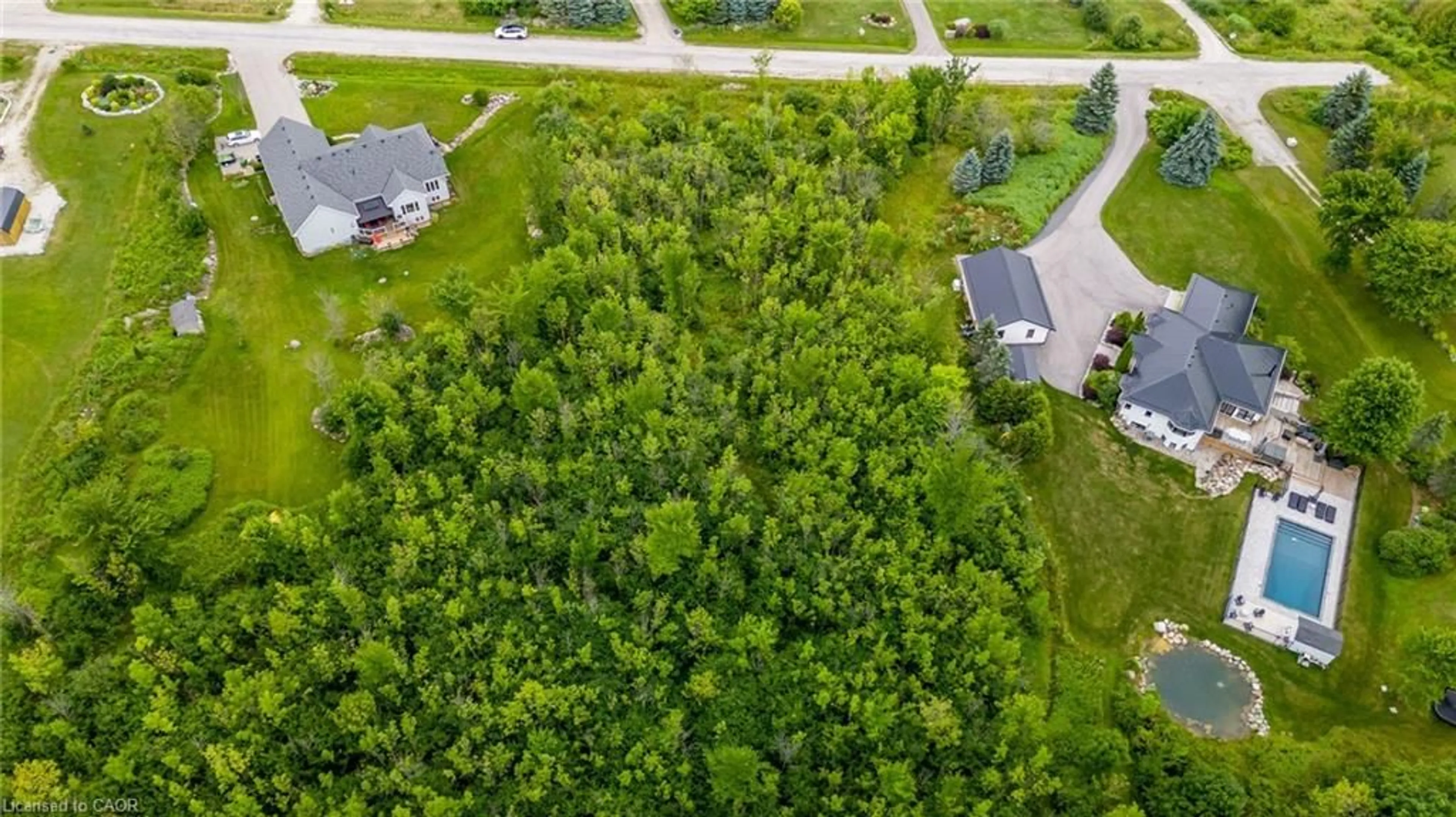 A pic from outside/outdoor area/front of a property/back of a property/a pic from drone, forest/trees view for 106 Ridgecrest Lane, Meaford Municipality Ontario N4L 1W6