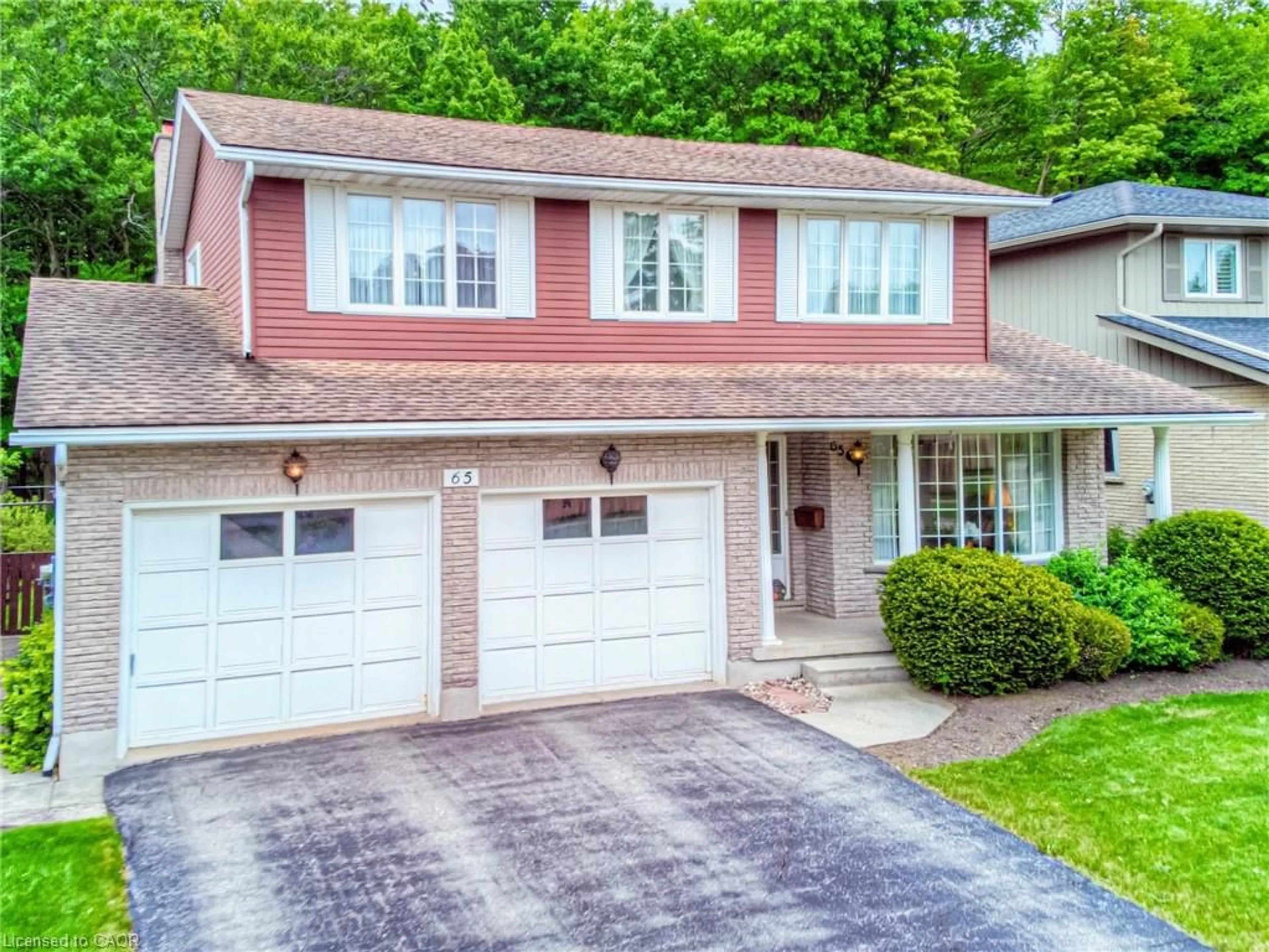 Home with brick exterior material, street for 65 Trailview Dr, Kitchener Ontario N2N 1P7