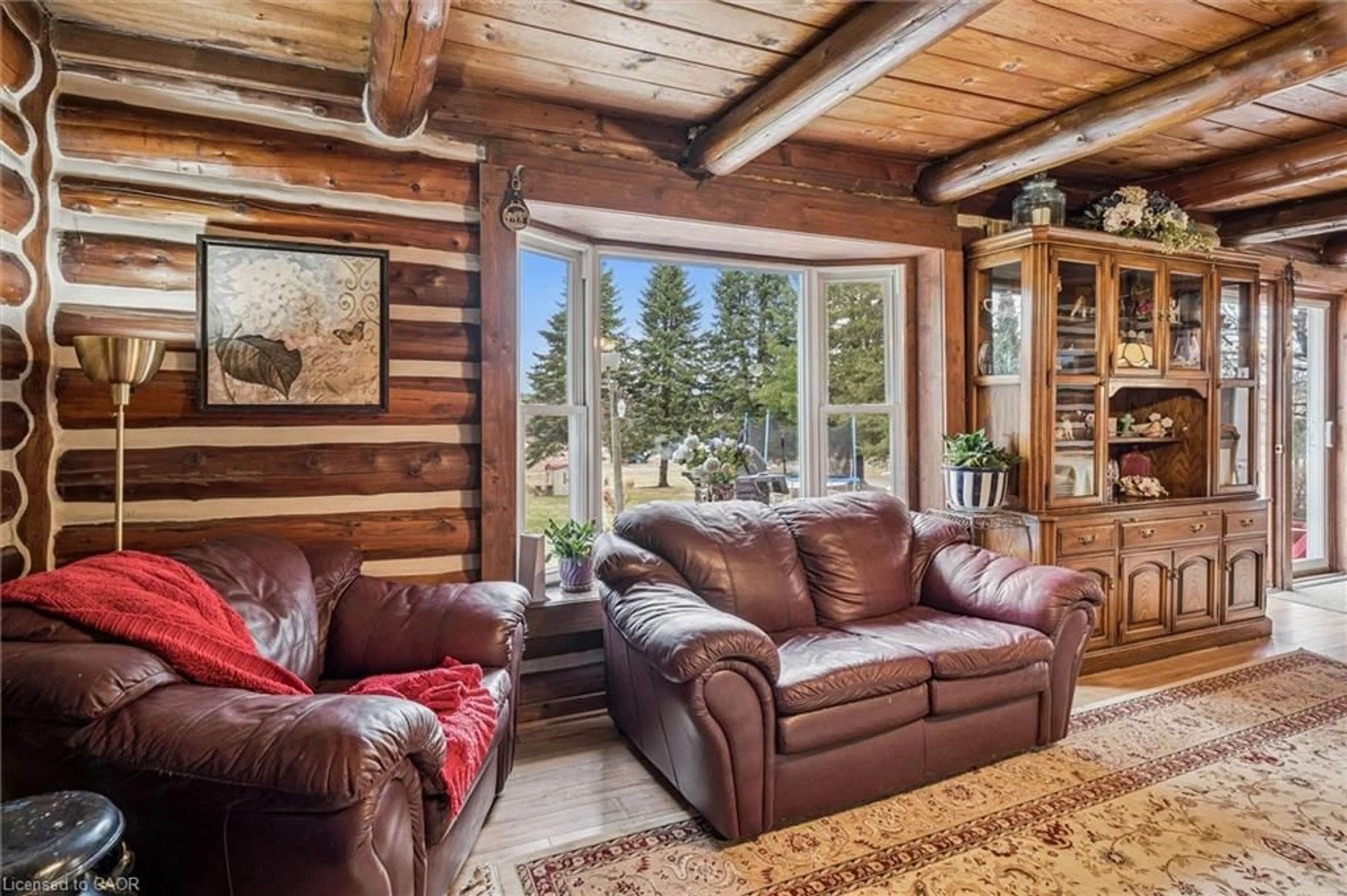 Living room with furniture, wood/laminate floor for 411A Peggs Mountain Rd, Burk's Falls Ontario P0A 1C0