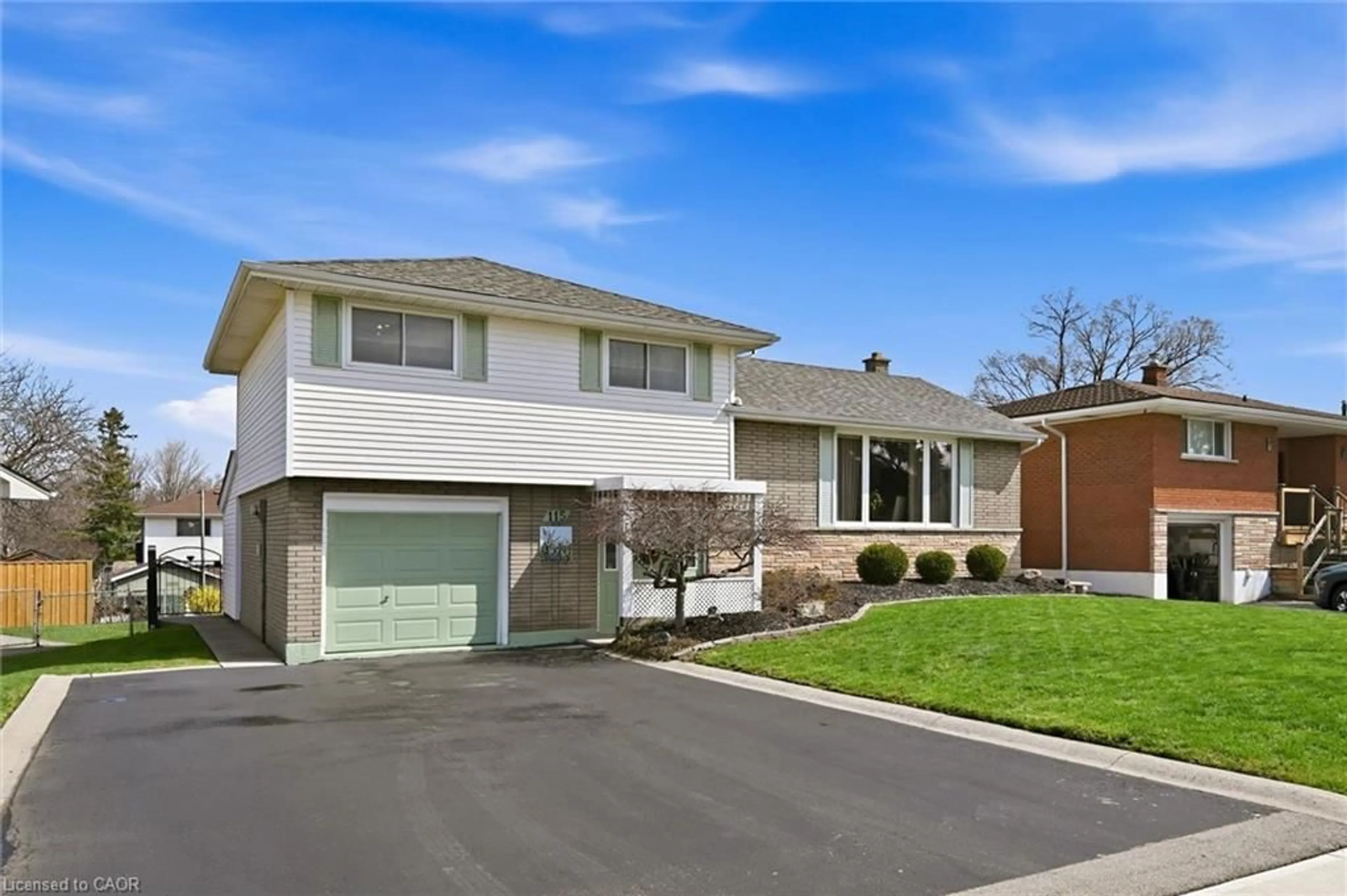 Home with vinyl exterior material, street for 115 Laurier Ave, Hamilton Ontario L9C 3S5