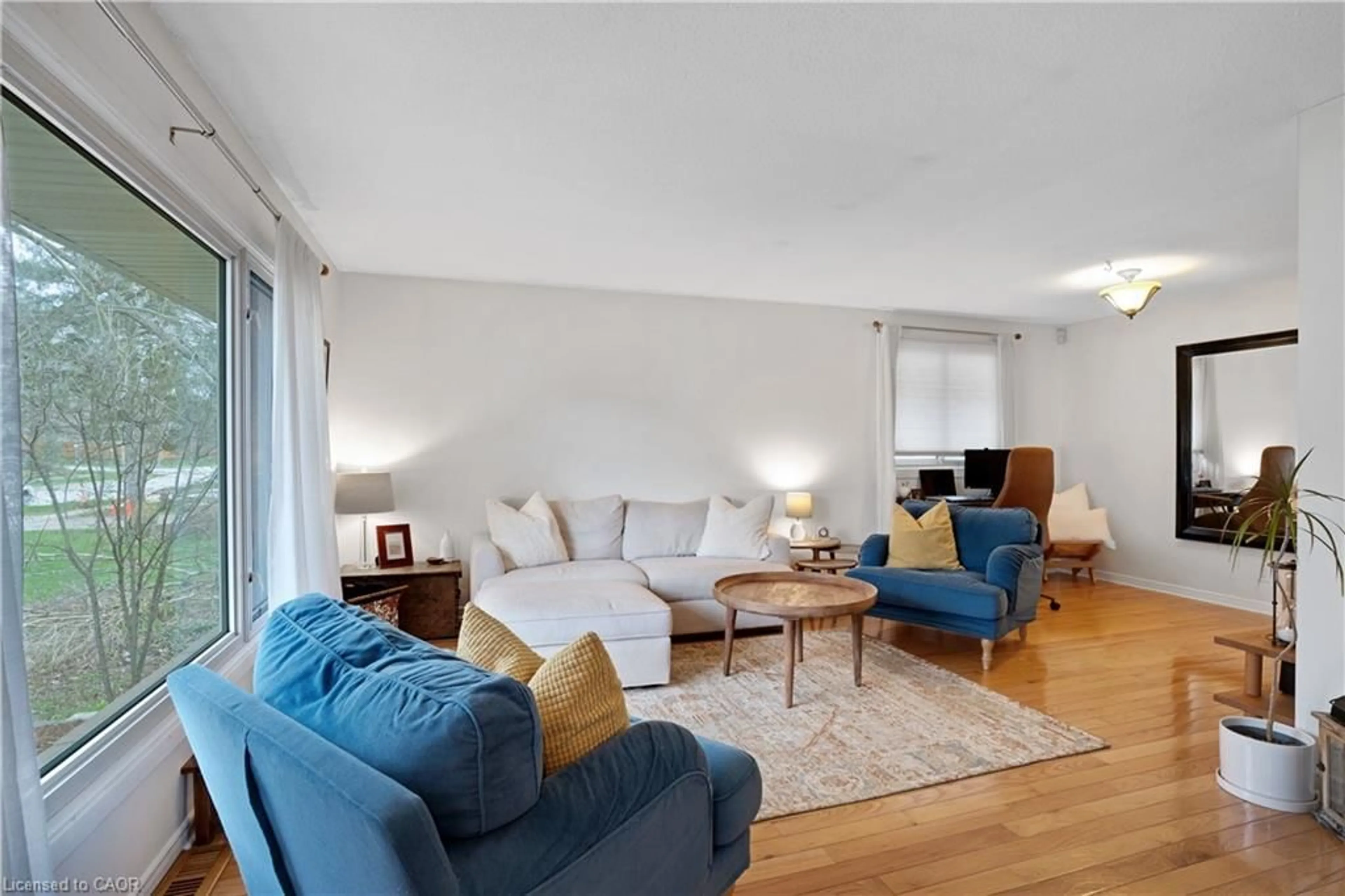 Living room with furniture, wood/laminate floor for 218 Blair Rd, Cambridge Ontario N1S 2J8