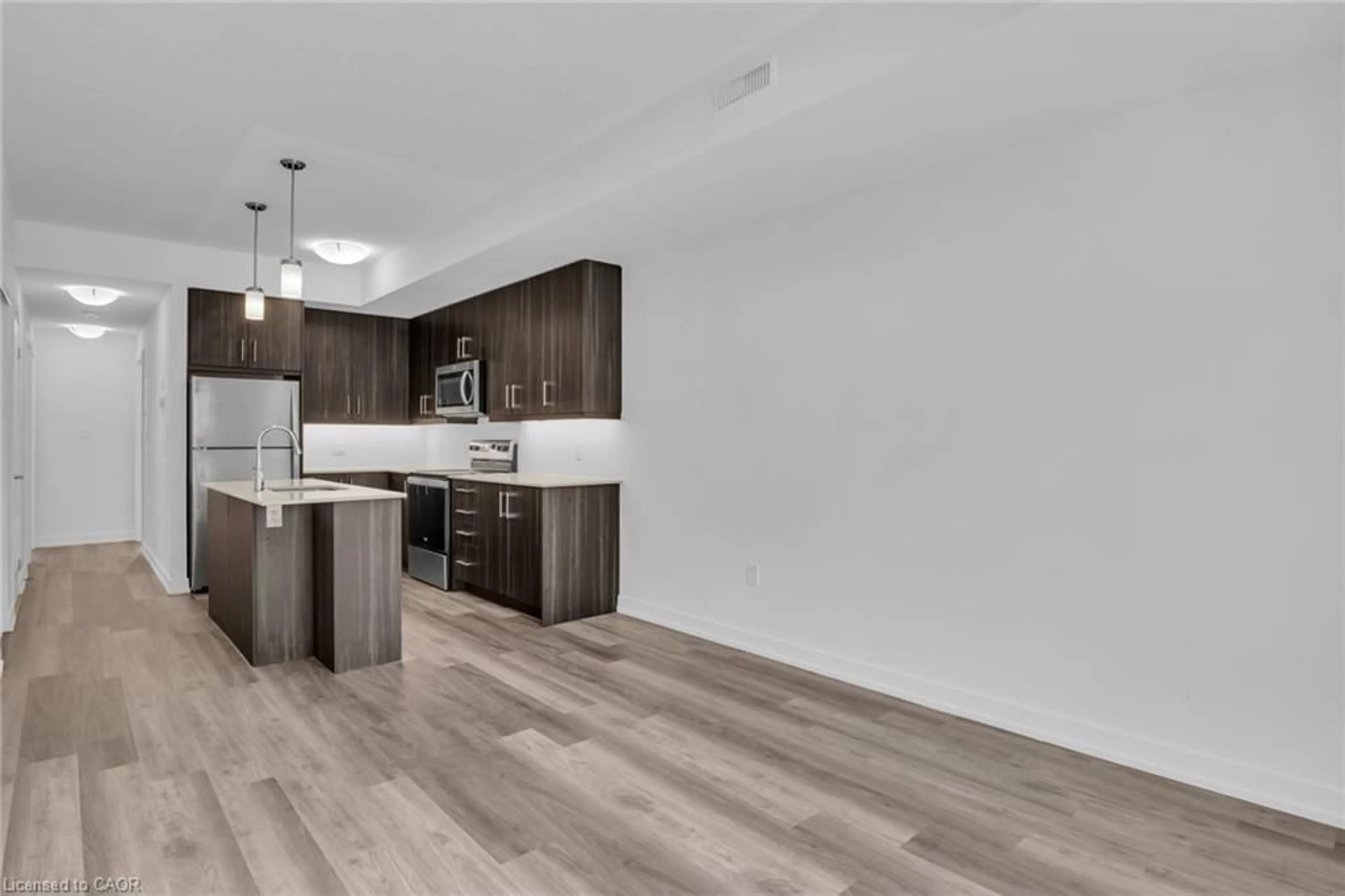 Open concept kitchen, wood/laminate floor for 20 Palace St #G7, Kitchener Ontario N2E 0J3
