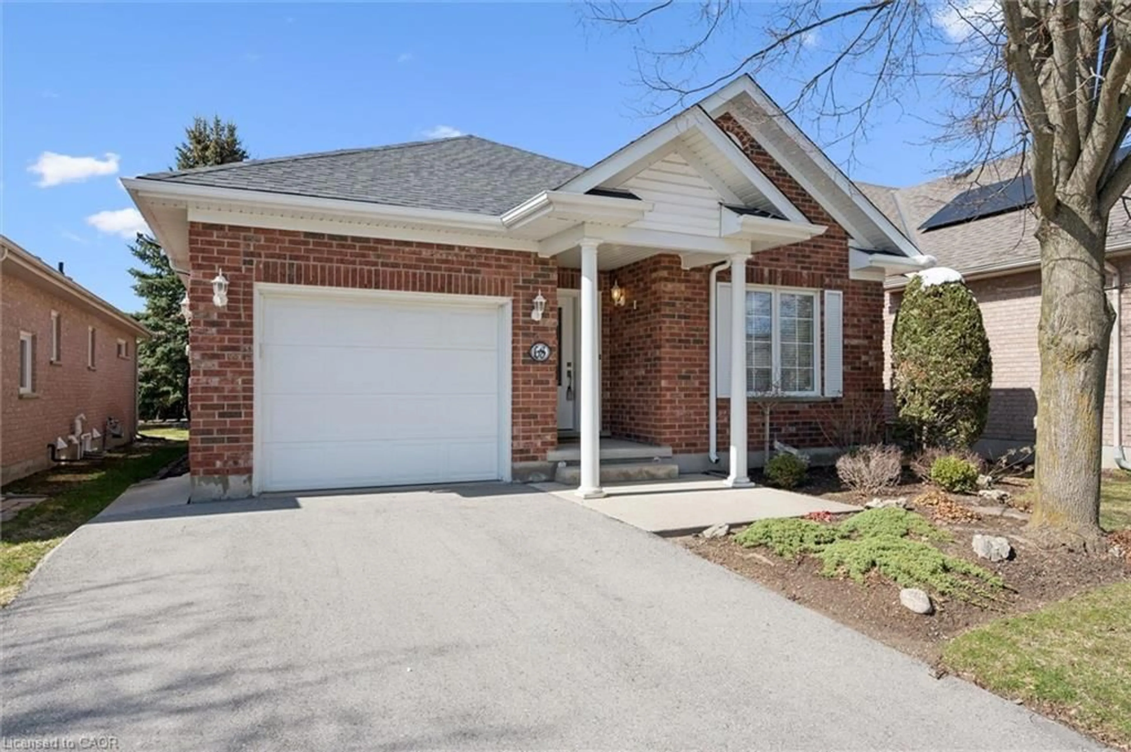 Home with brick exterior material, street for 68 Basswood Dr, Guelph Ontario N1G 4X7