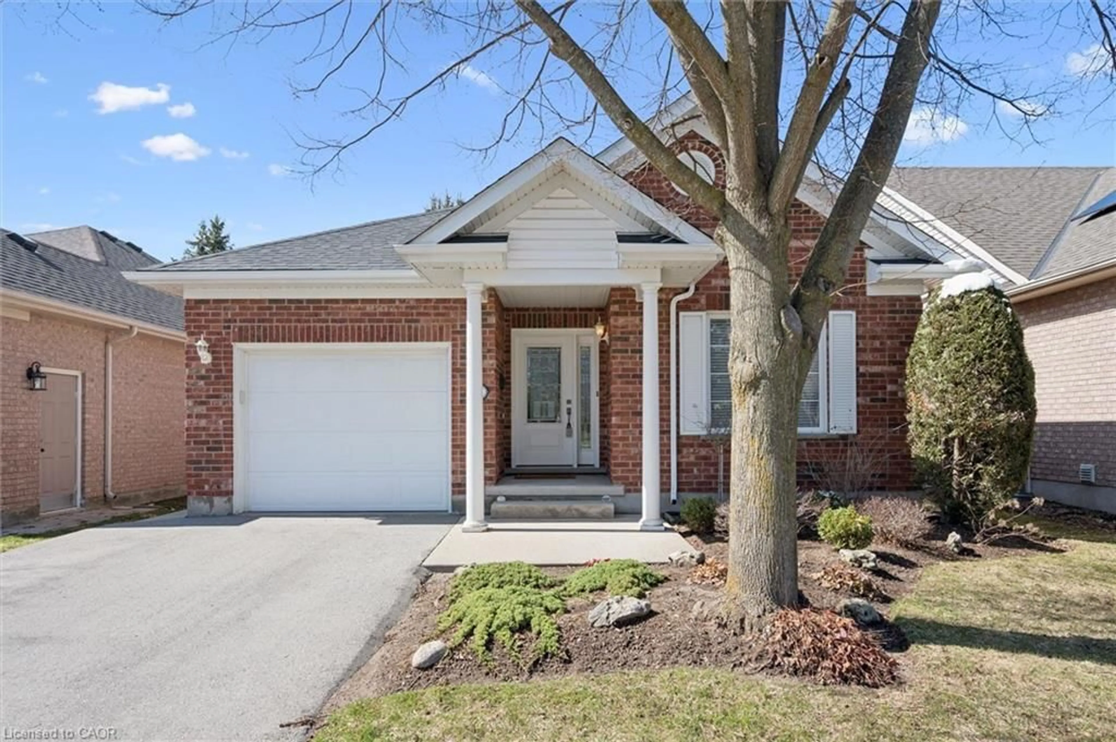 Home with brick exterior material, street for 68 Basswood Dr, Guelph Ontario N1G 4X7