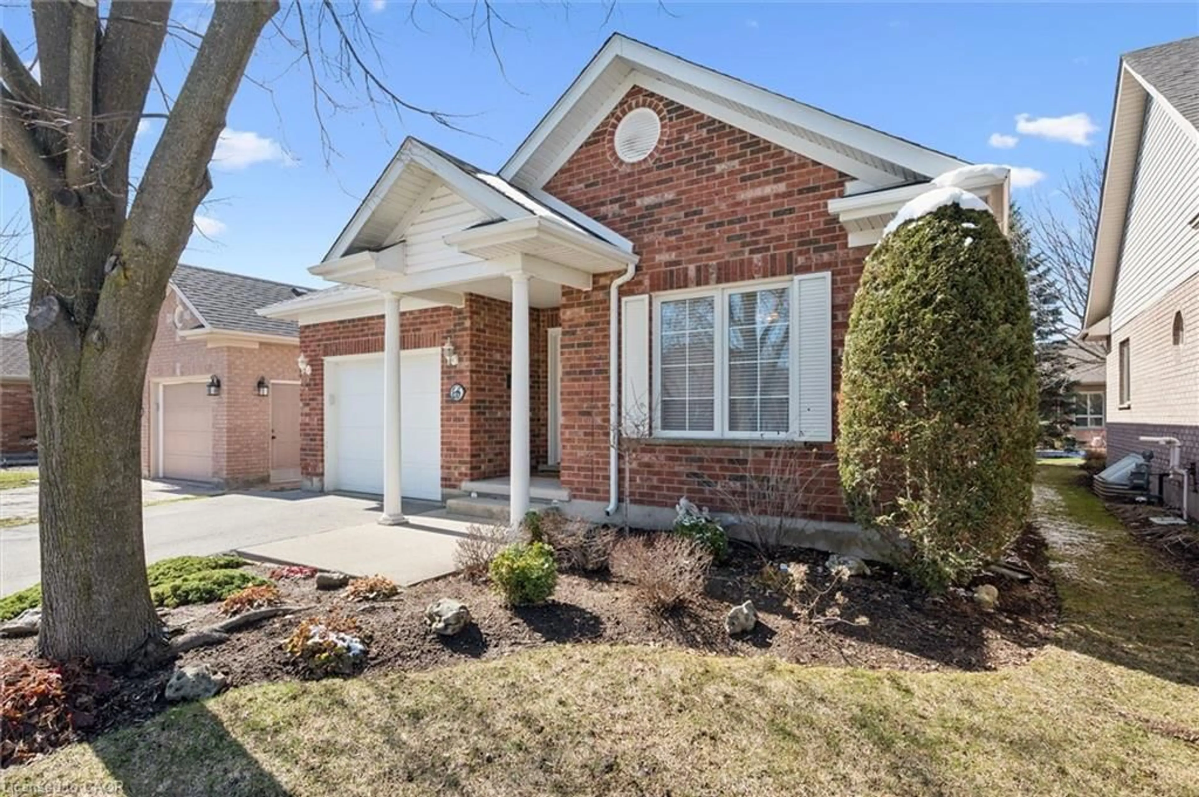 Home with brick exterior material, street for 68 Basswood Dr, Guelph Ontario N1G 4X7