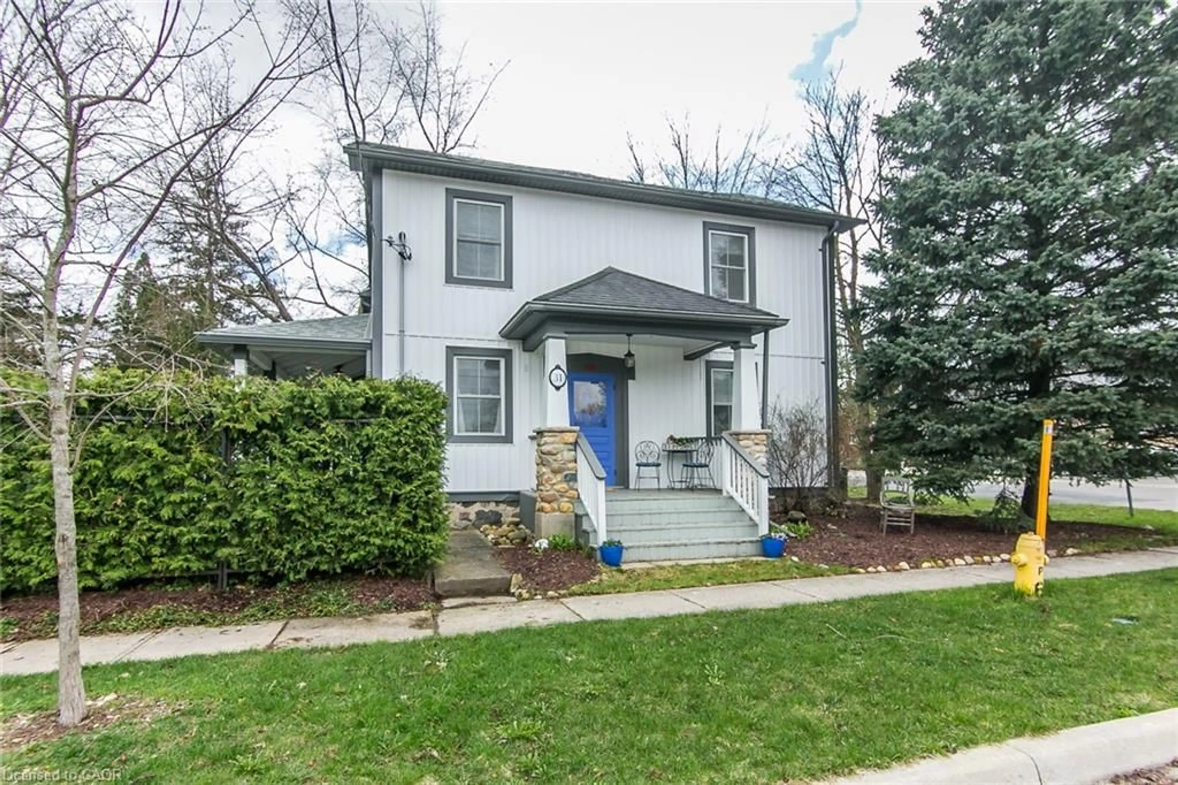 Home with vinyl exterior material, street for 31 Front St, St. Jacobs Ontario N0B 2N0