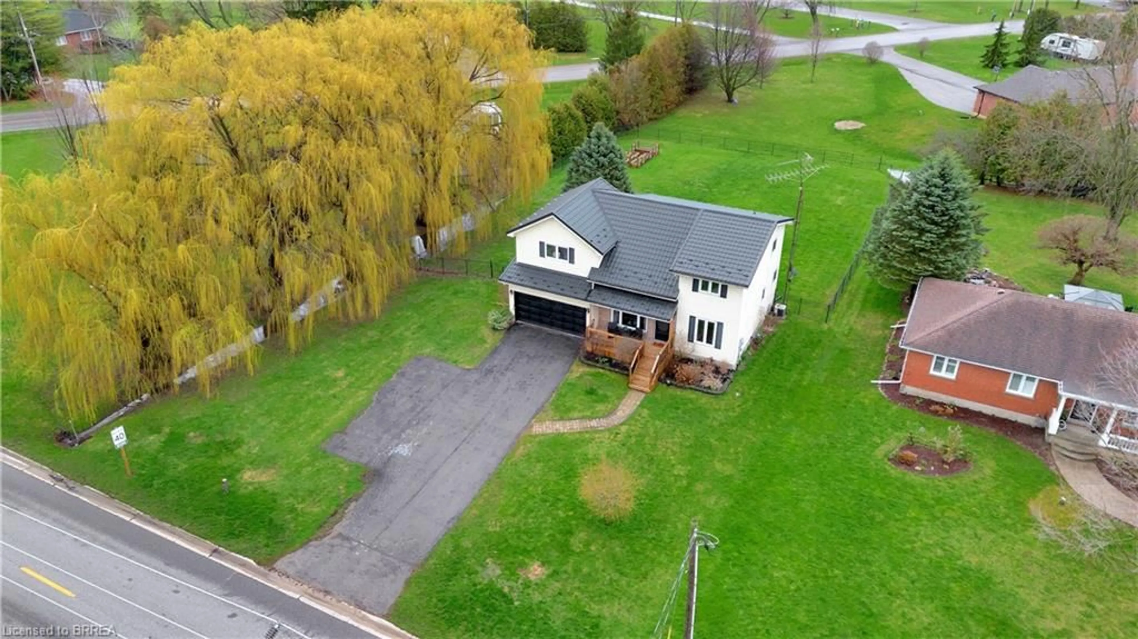A pic from outside/outdoor area/front of a property/back of a property/a pic from drone, street for 934 Norfolk County Road 19e, Wilsonville Ontario N0E 1Z0