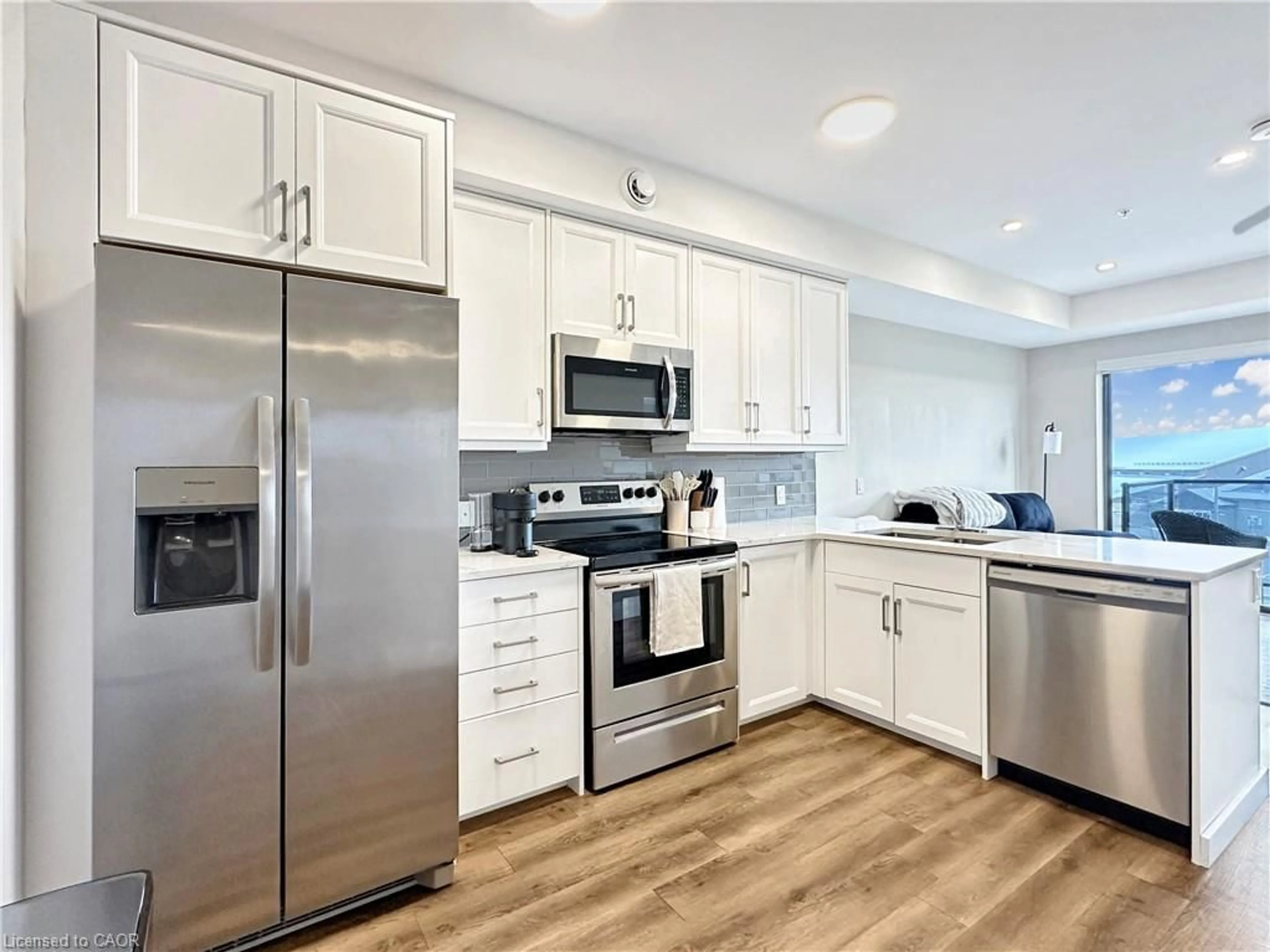 Open concept kitchen, ceramic/tile floor for 64 Main St #303, Hagersville Ontario N0A 1H0