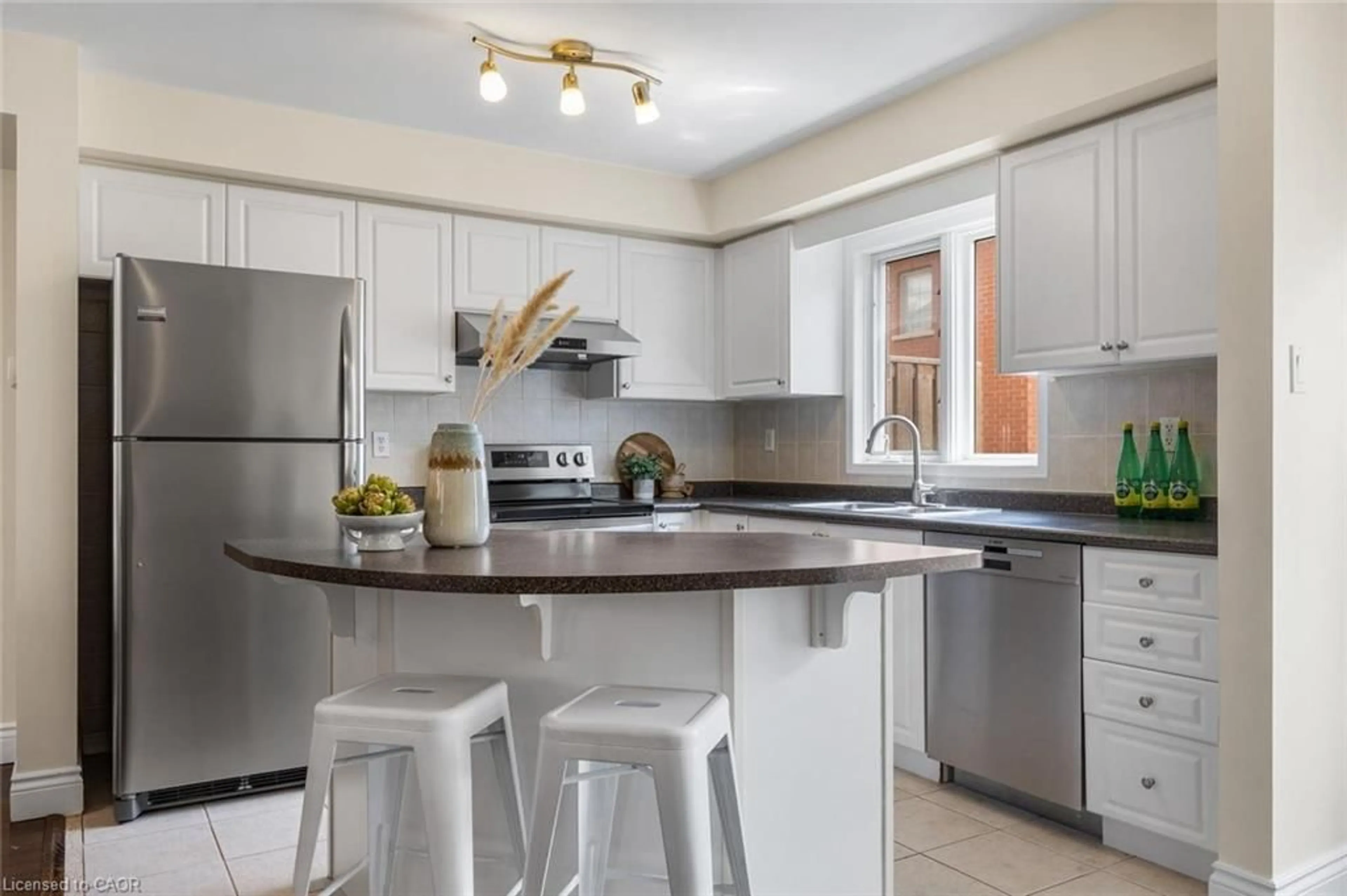 Open concept kitchen, ceramic/tile floor for 201 Tenth St #8, Etobicoke Ontario M8V 4C7