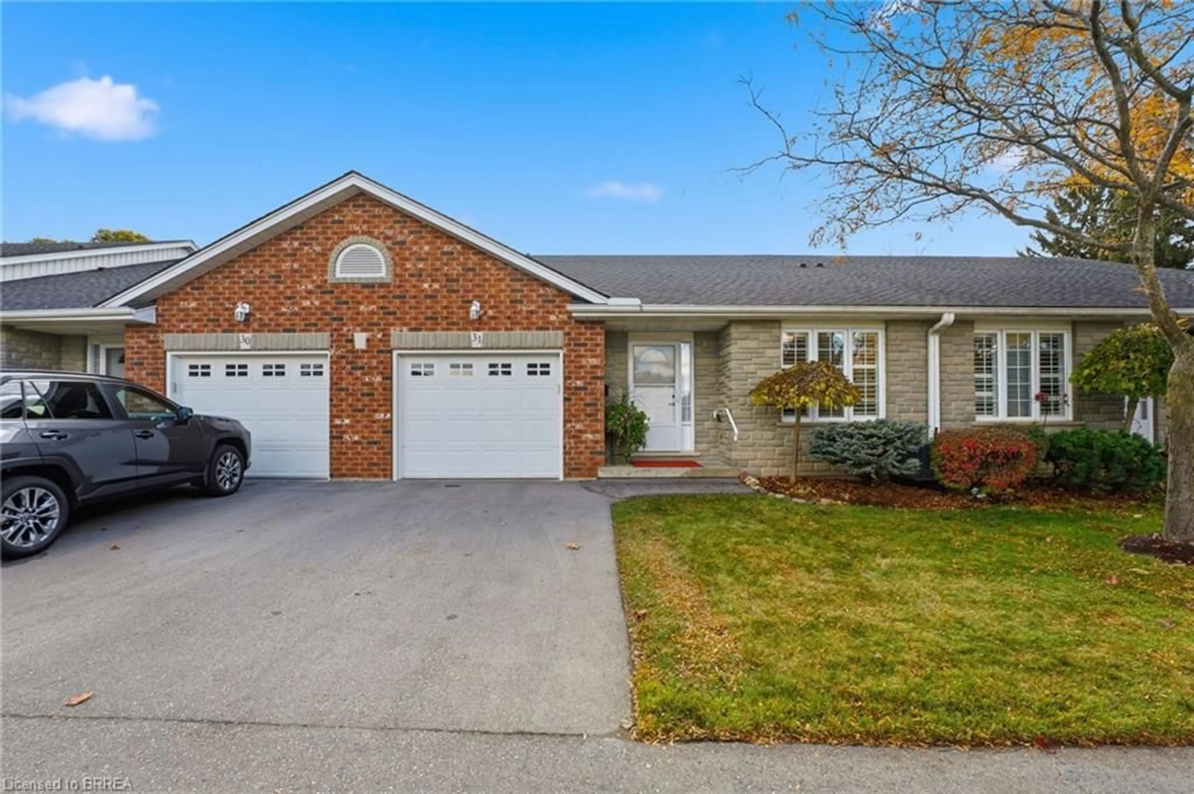 Home with brick exterior material, street for 53 Heron's Landng #31, Woodstock Ontario N4T 1V2