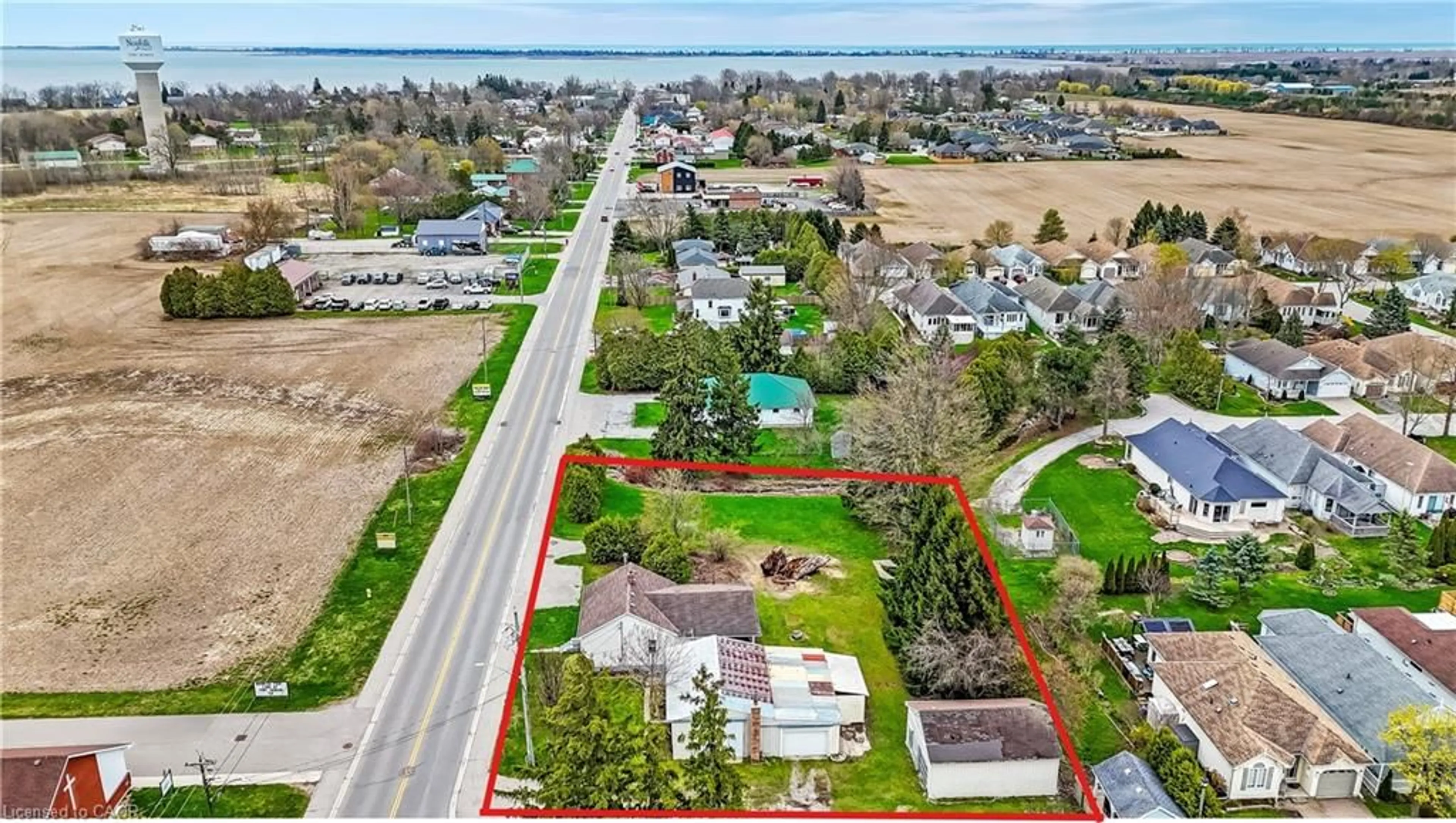 A pic from outside/outdoor area/front of a property/back of a property/a pic from drone, water/lake/river/ocean view for 1153 Bay St, Port Rowan Ontario N0E 1M0