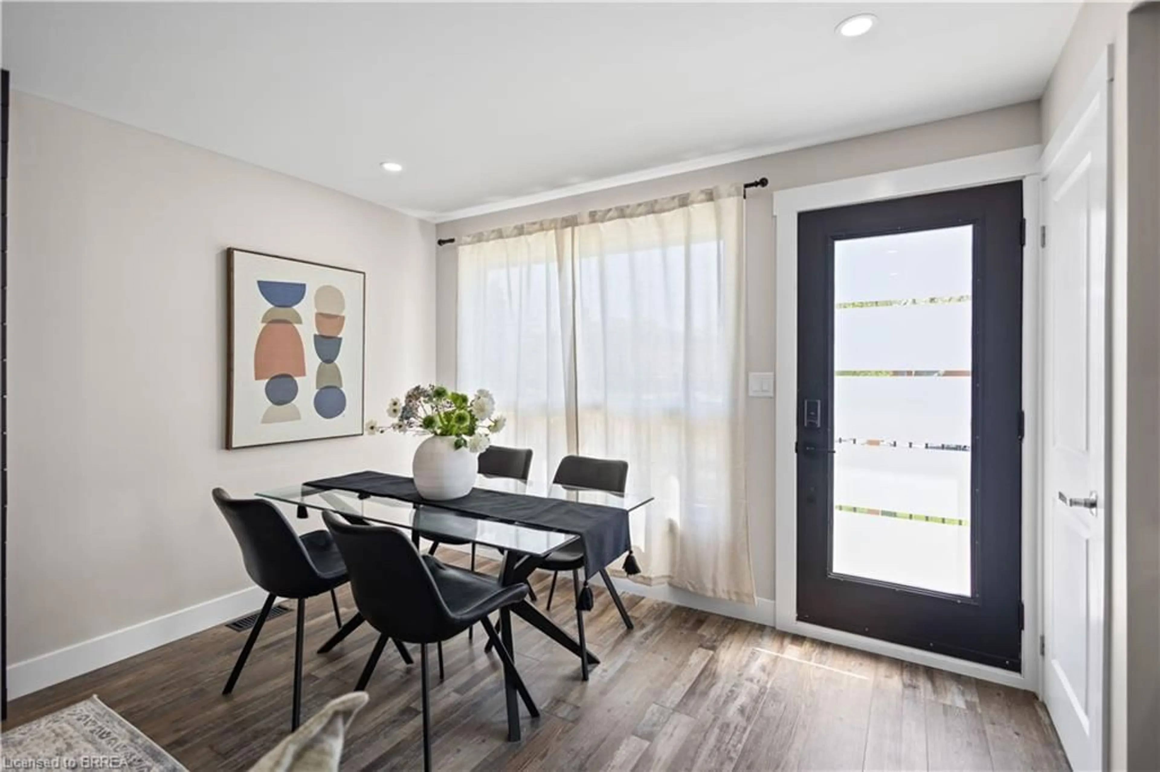 Dining room, wood/laminate floor for 48 Linden Ave, Brantford Ontario N3S 7E5