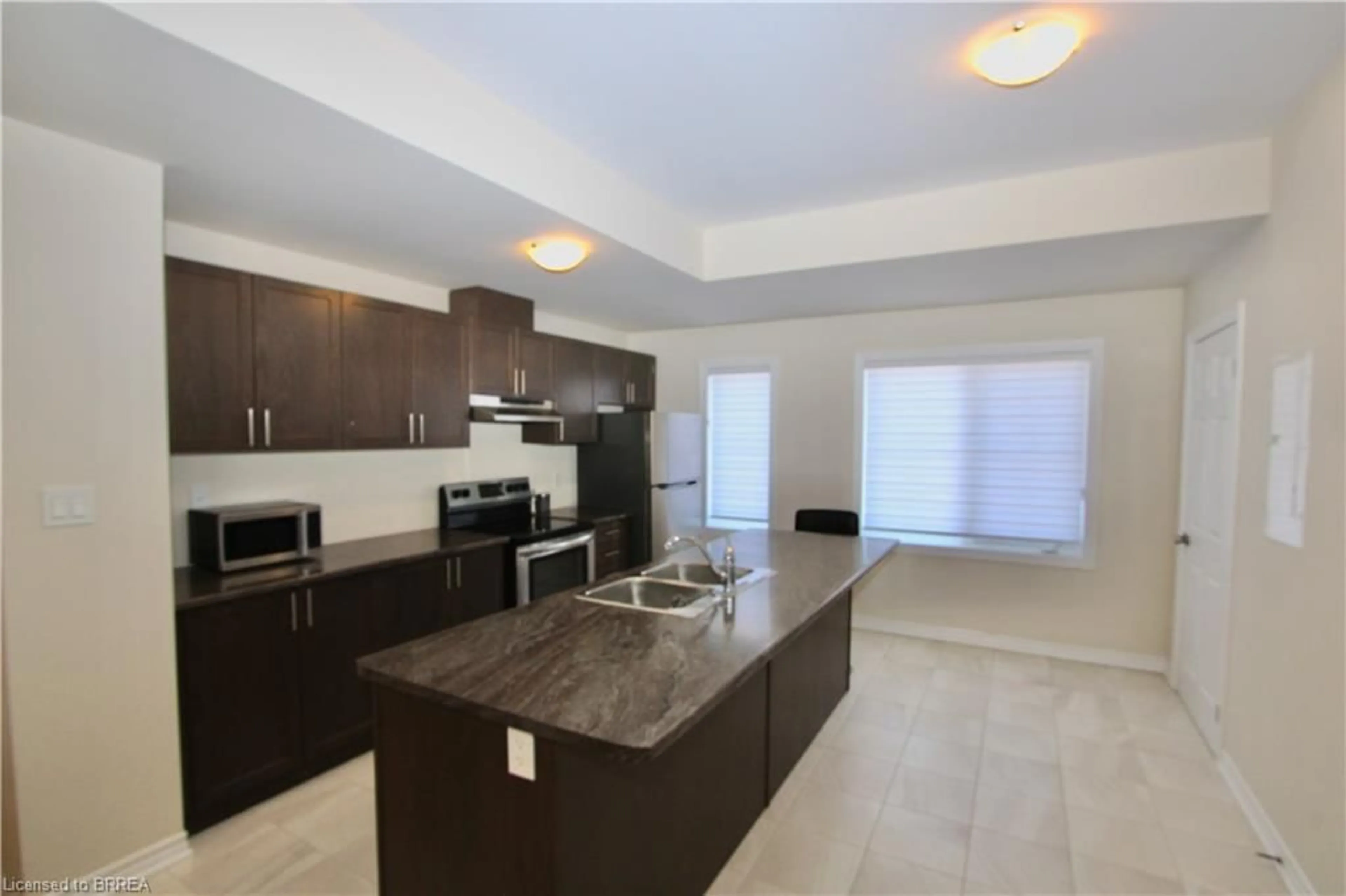 Open concept kitchen, ceramic/tile floor for 677 Park St #13, Brantford Ontario N3R 0A2