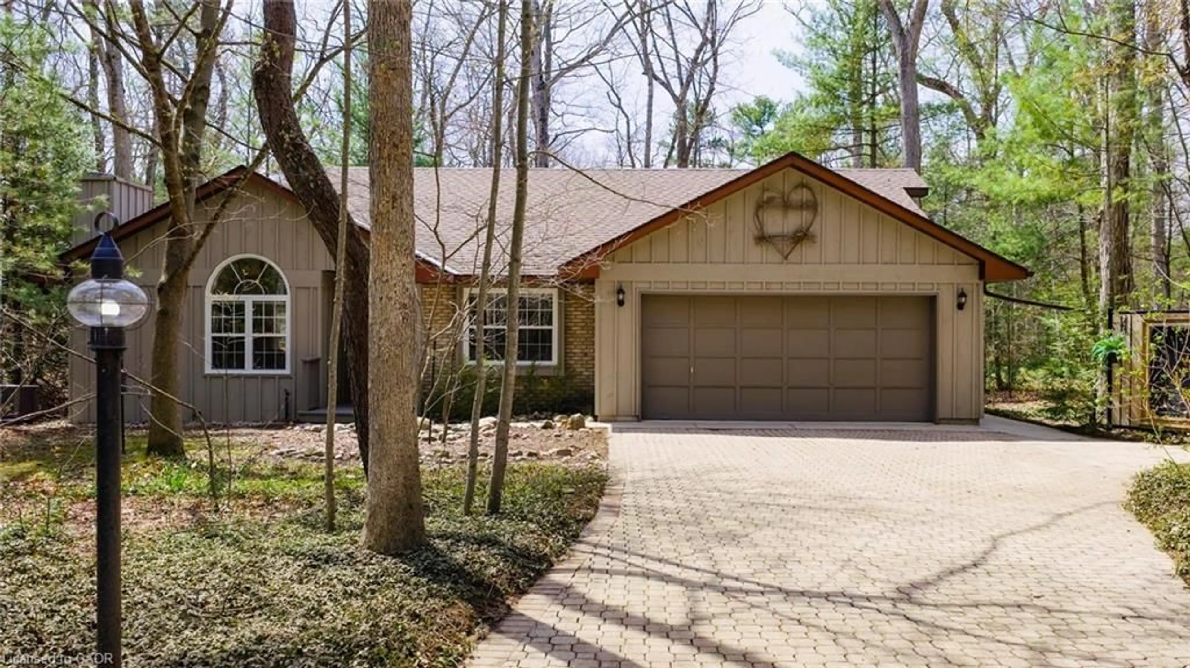 Home with brick exterior material, street for 10325 Grand Oaks Dr, Grand Bend Ontario N0M 1T0