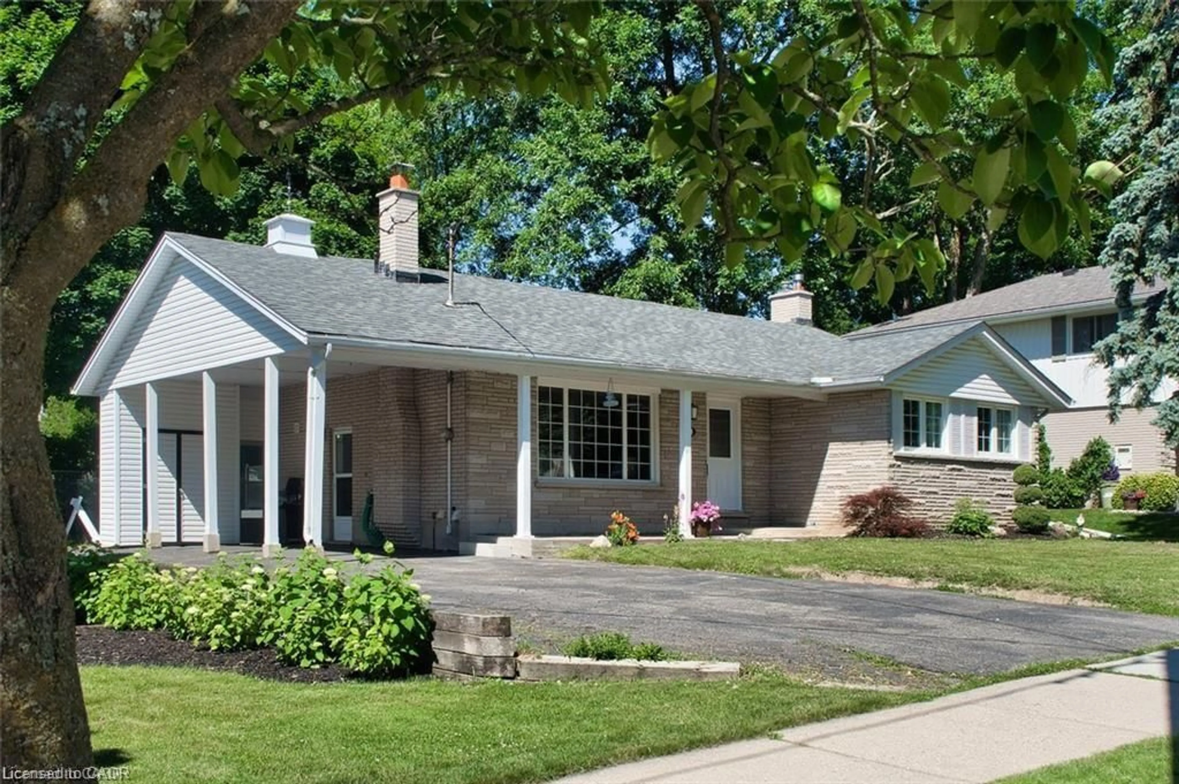 Home with vinyl exterior material, street for 115 Uplands Dr, Kitchener Ontario N2M 4X3