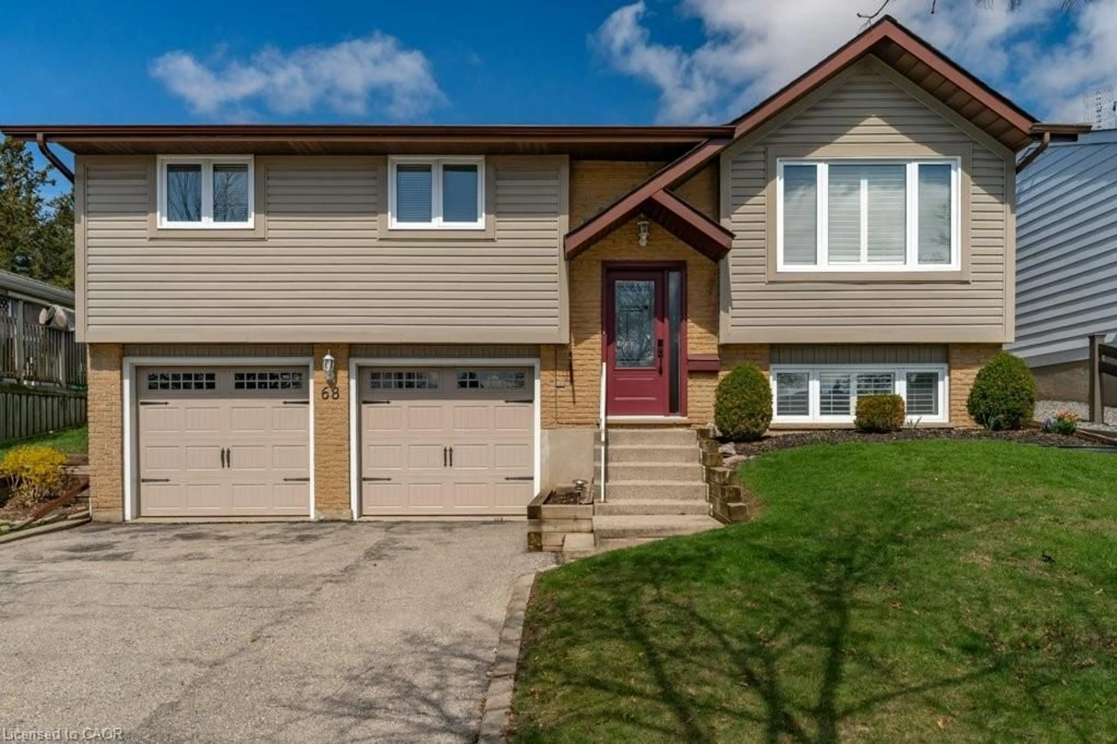 Home with vinyl exterior material, street for 68 Settlers Dr, Kitchener Ontario N2E 2L8