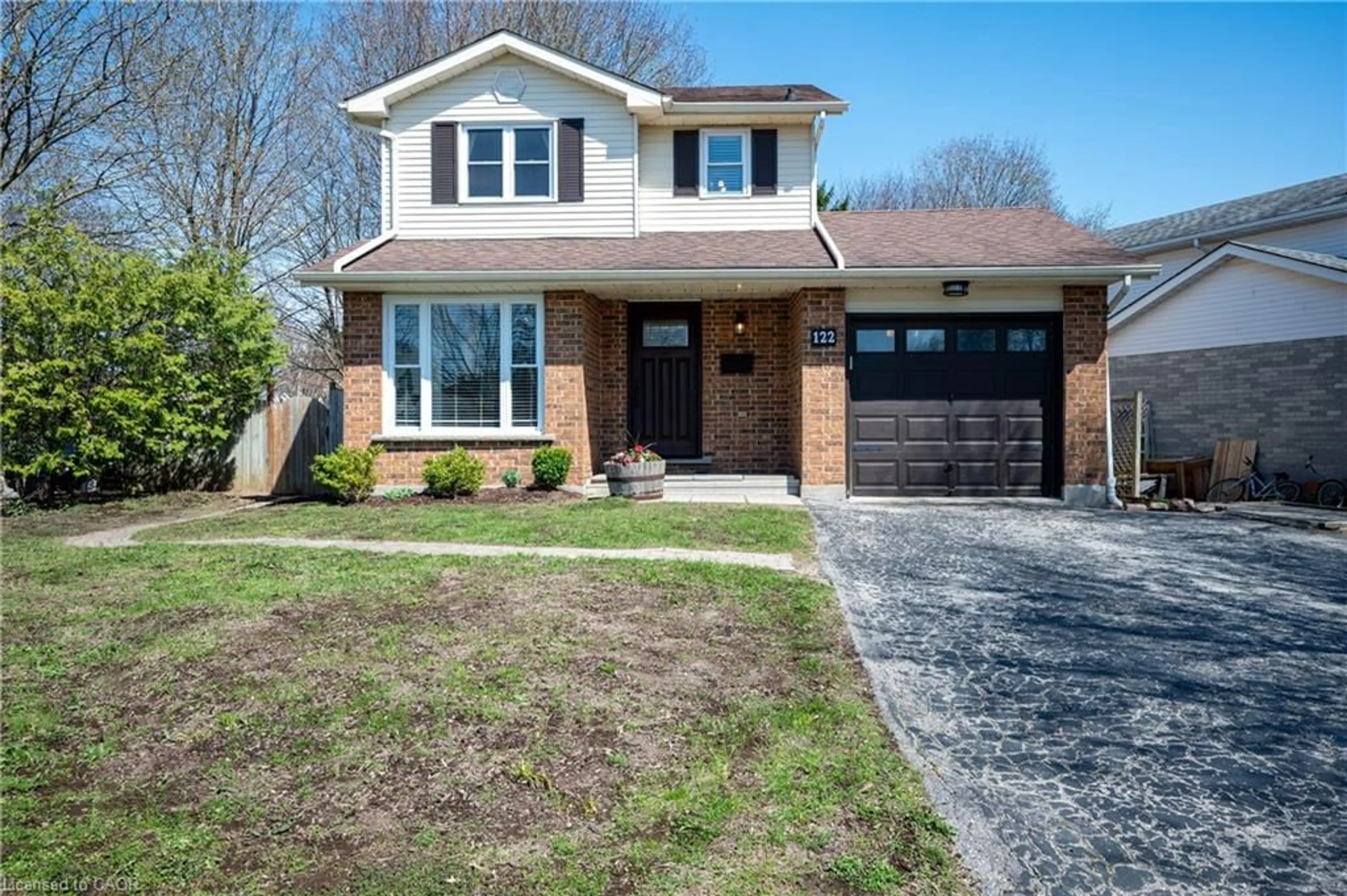 Home with brick exterior material, street for 122 Foxhunt Rd, Waterloo Ontario N2K 3N1