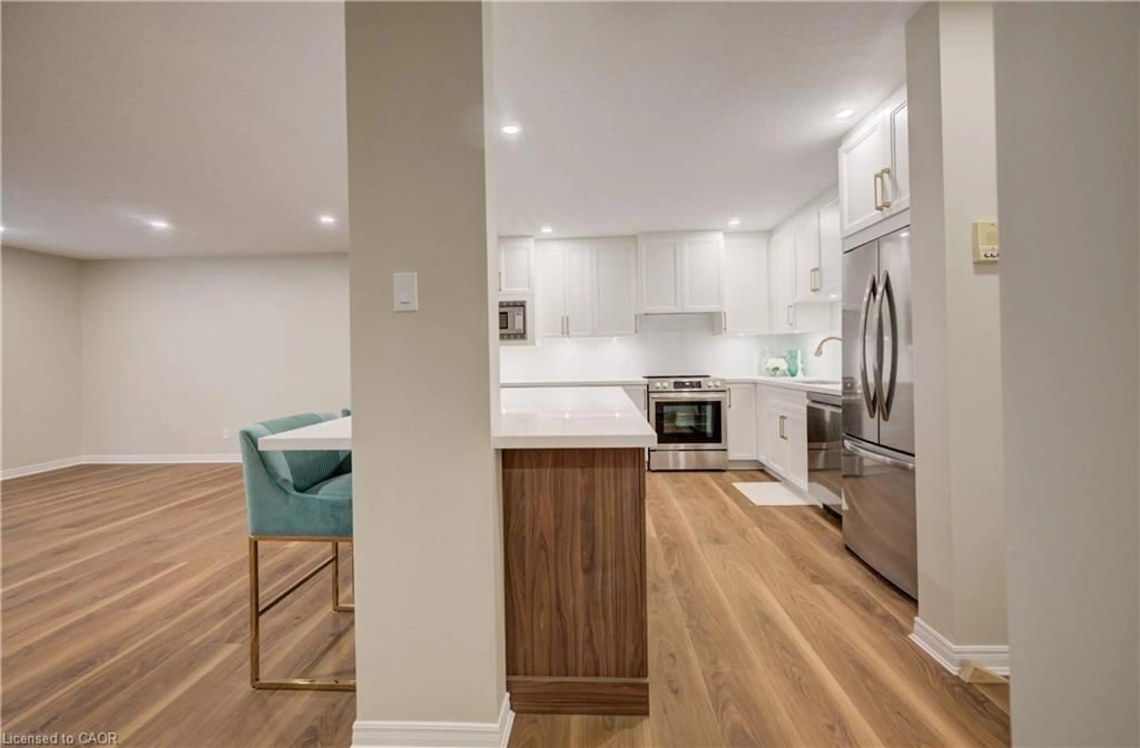 Open concept kitchen, wood/laminate floor for 440 Durham St #105, Mount Forest Ontario N0G 2L1