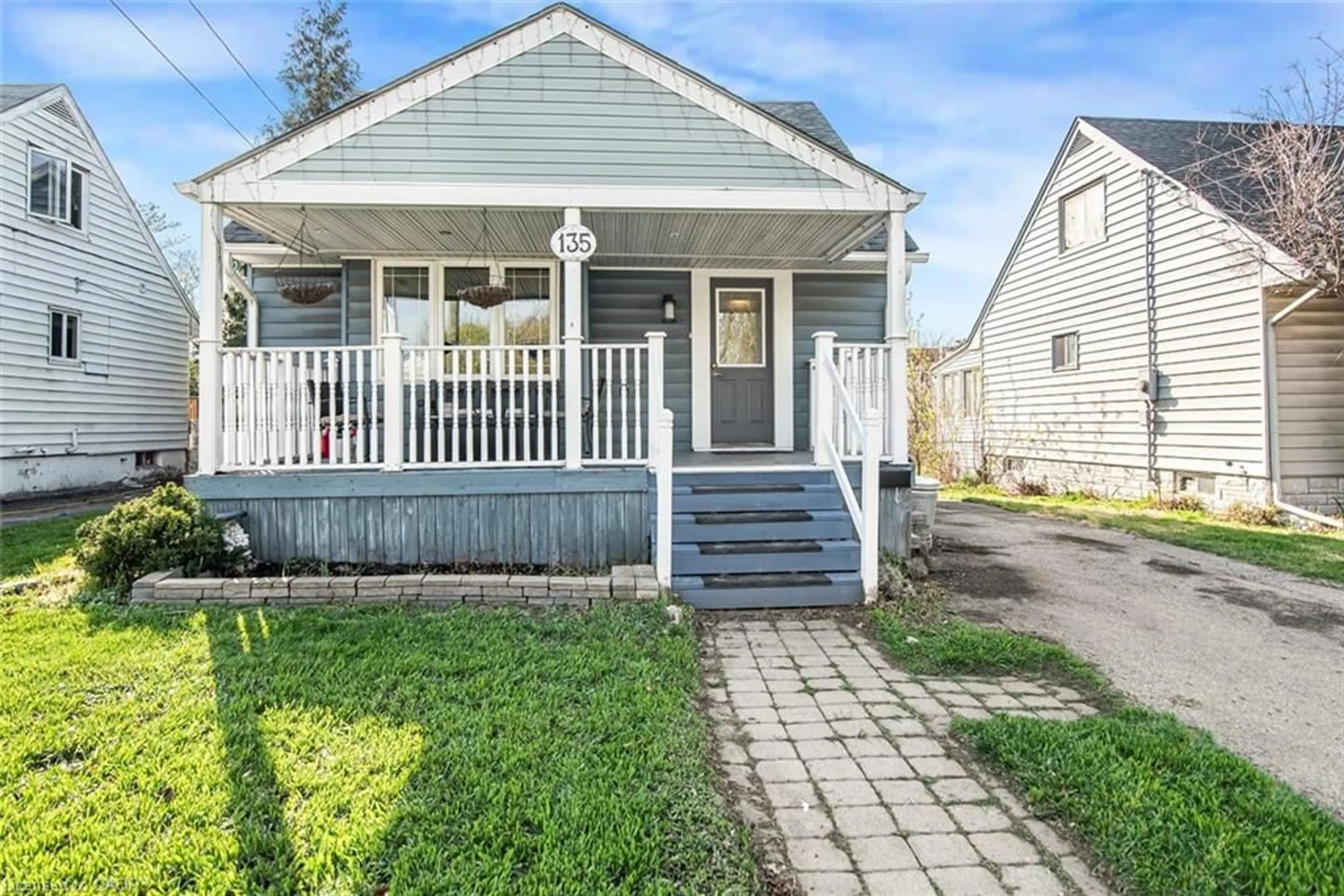 Home with vinyl exterior material, street for 135 Glassco Ave, Hamilton Ontario L8H 6A1