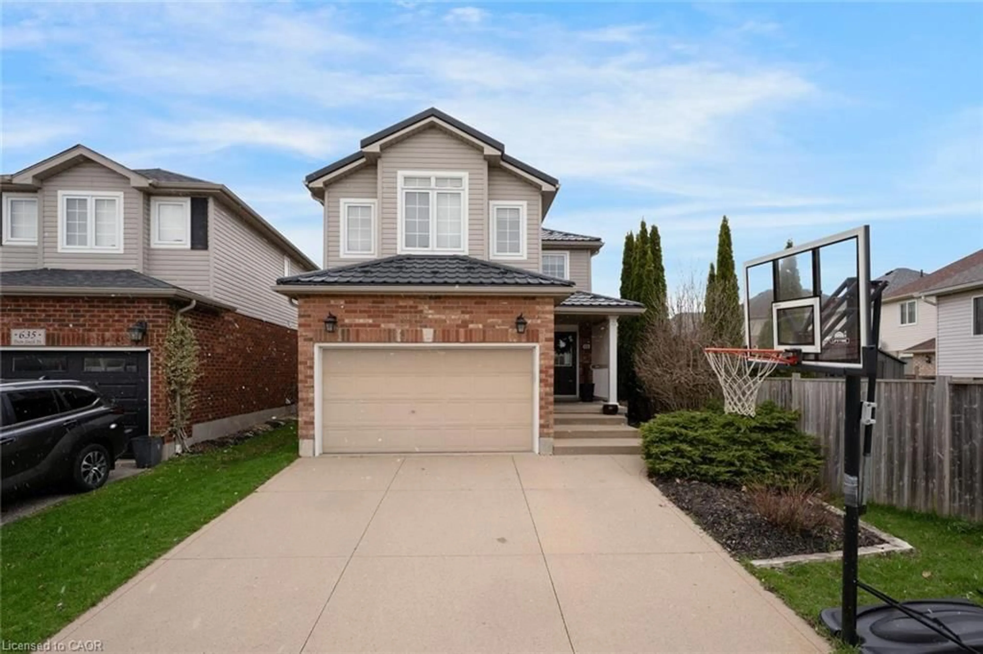 Home with brick exterior material, street for 631 Doon South Dr, Kitchener Ontario N2P 2X5