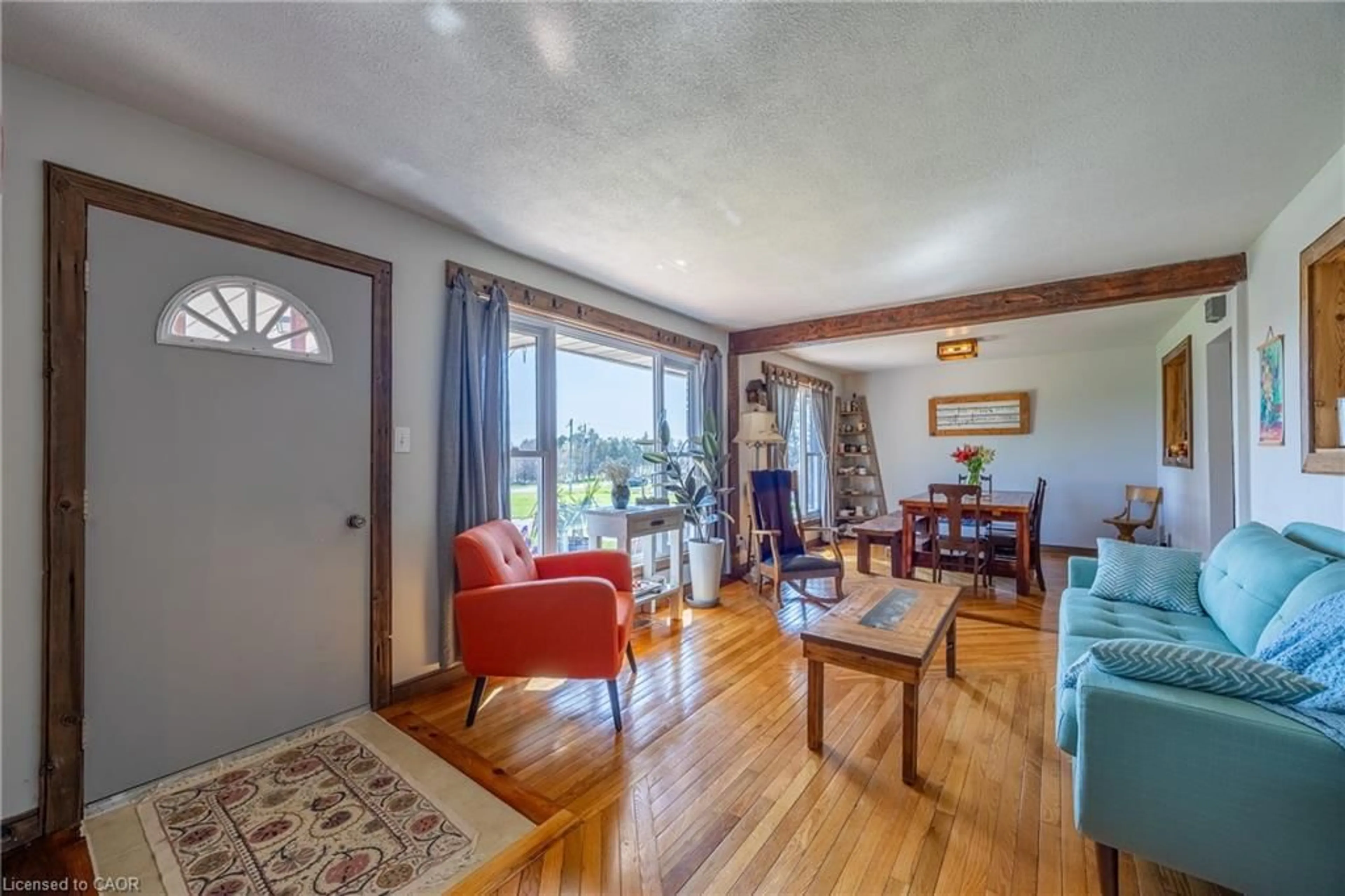 Living room with furniture, wood/laminate floor for 261 West Quarter Line Rd, Port Rowan Ontario N0E 1M0