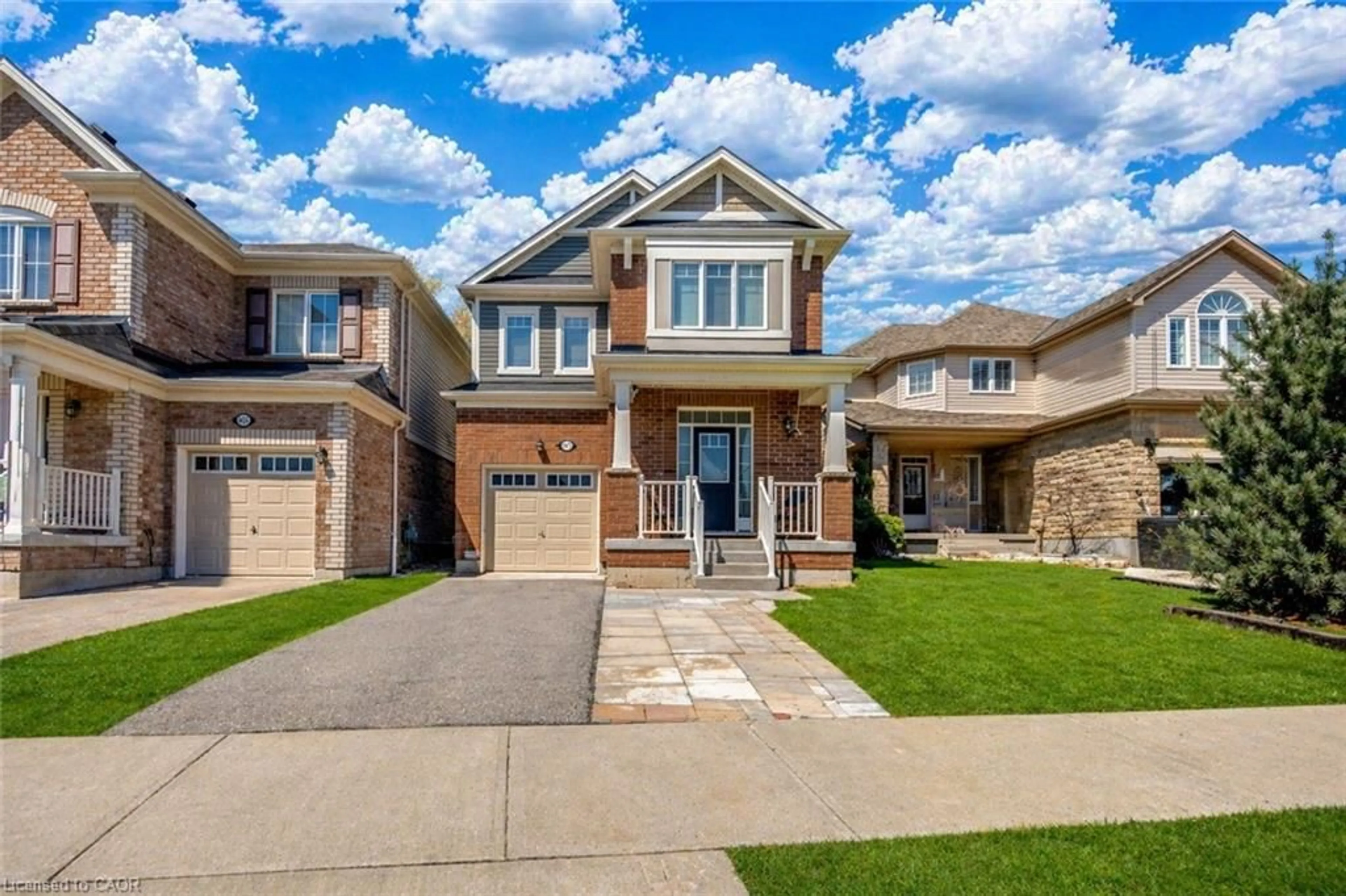 Home with brick exterior material, street for 661 Doon South Dr, Kitchener Ontario N2P 0H5