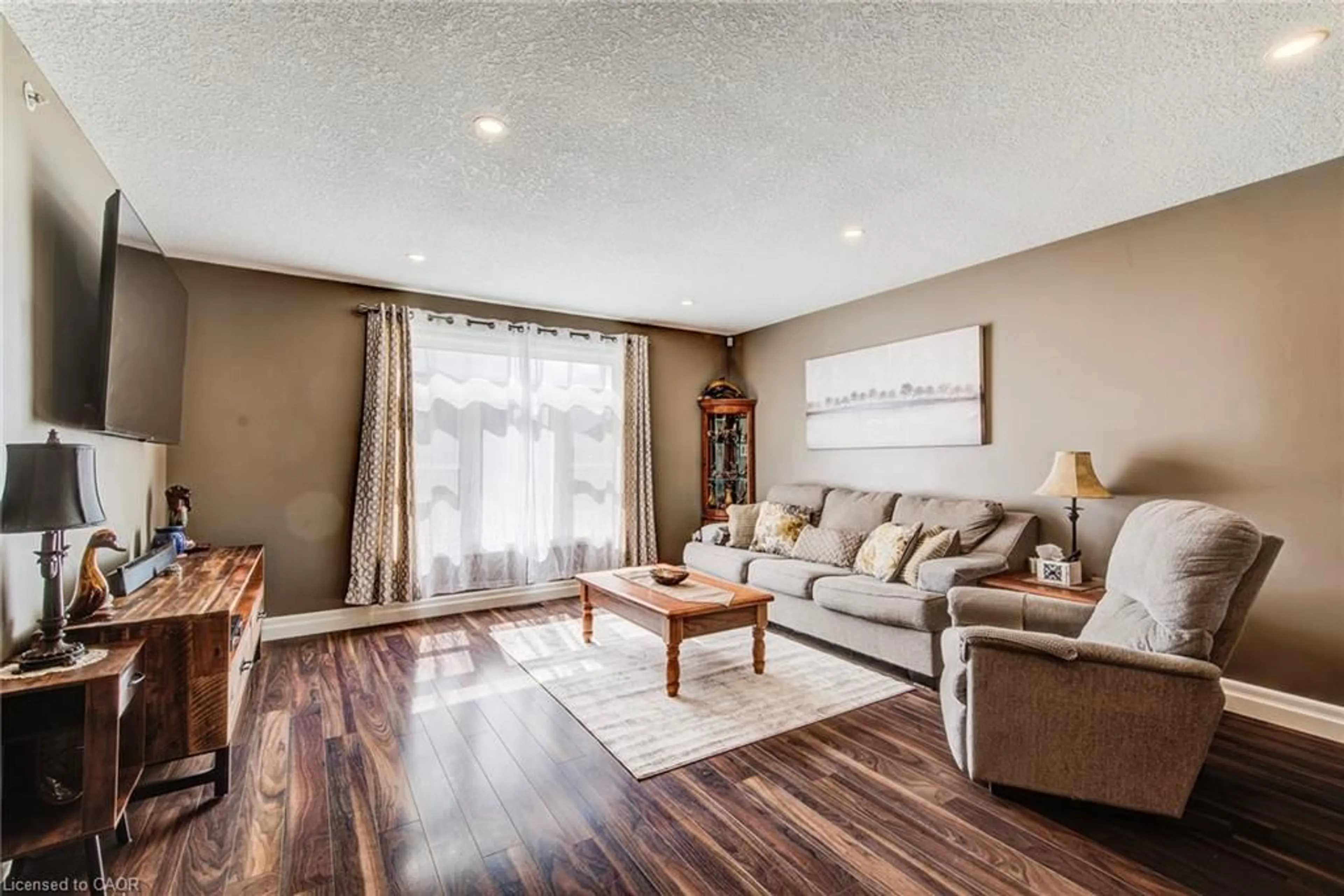 Living room with furniture, wood/laminate floor for 1025 Reserve Ave, Listowel Ontario N4W 0B5