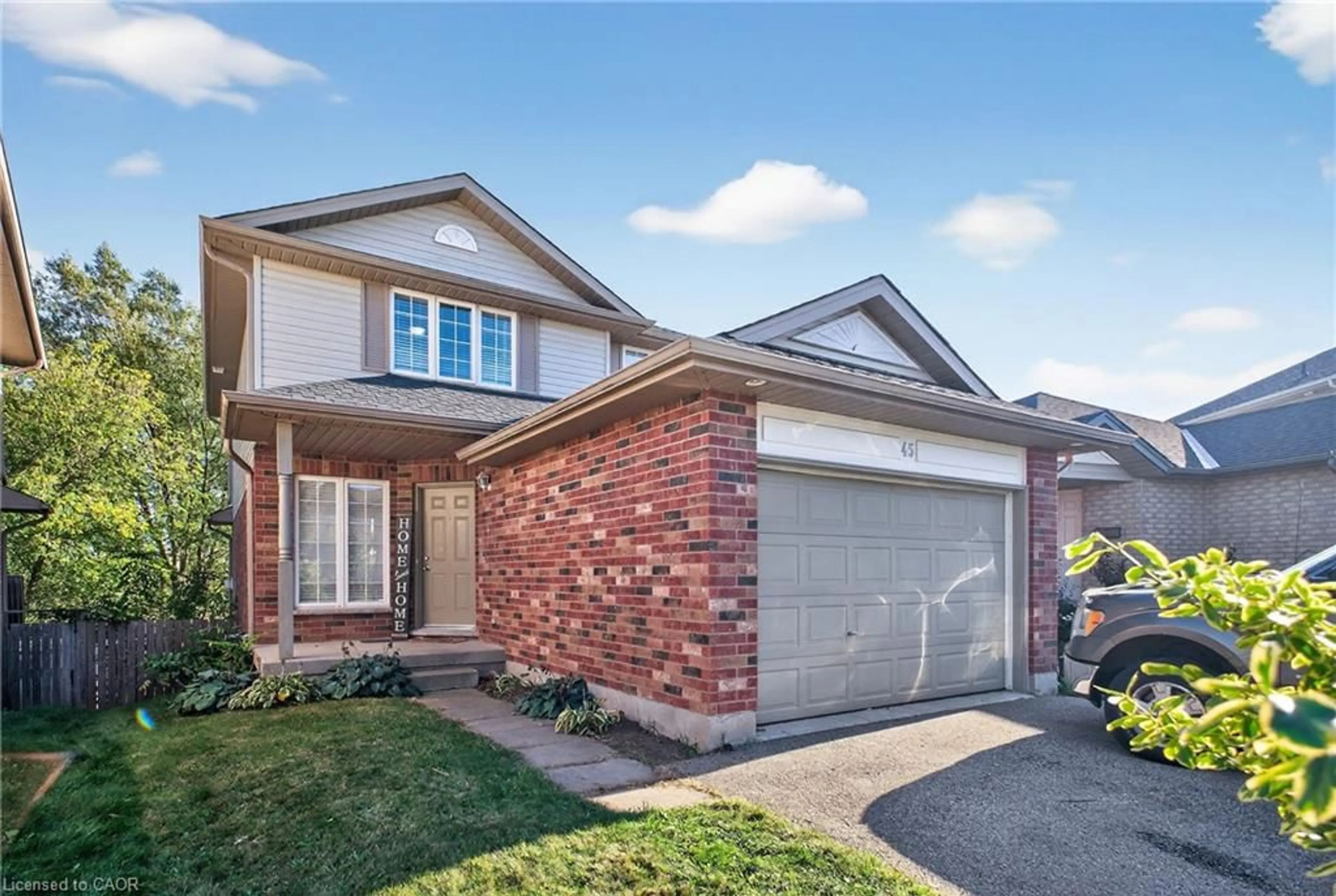 Home with brick exterior material, street for 45 Valleyhaven Lane, Guelph Ontario N1E 0A5