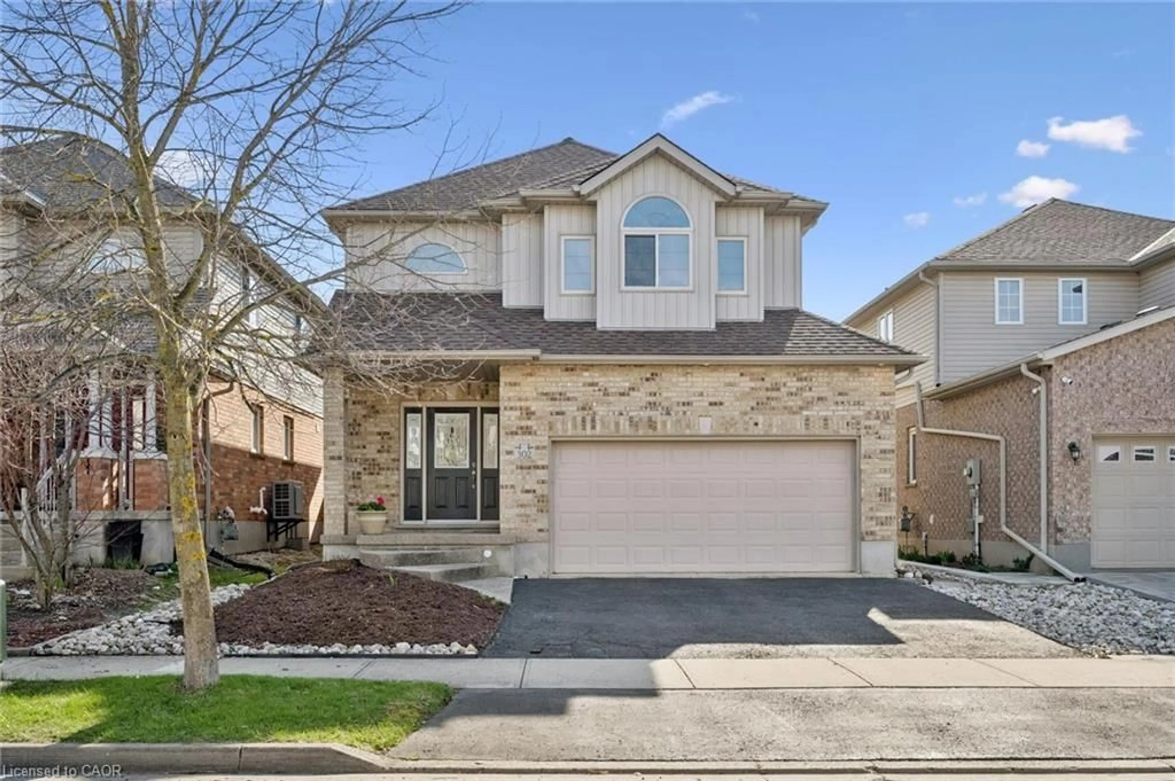 Home with brick exterior material, street for 302 Red Osier Rd, Waterloo Ontario N2V 2V7