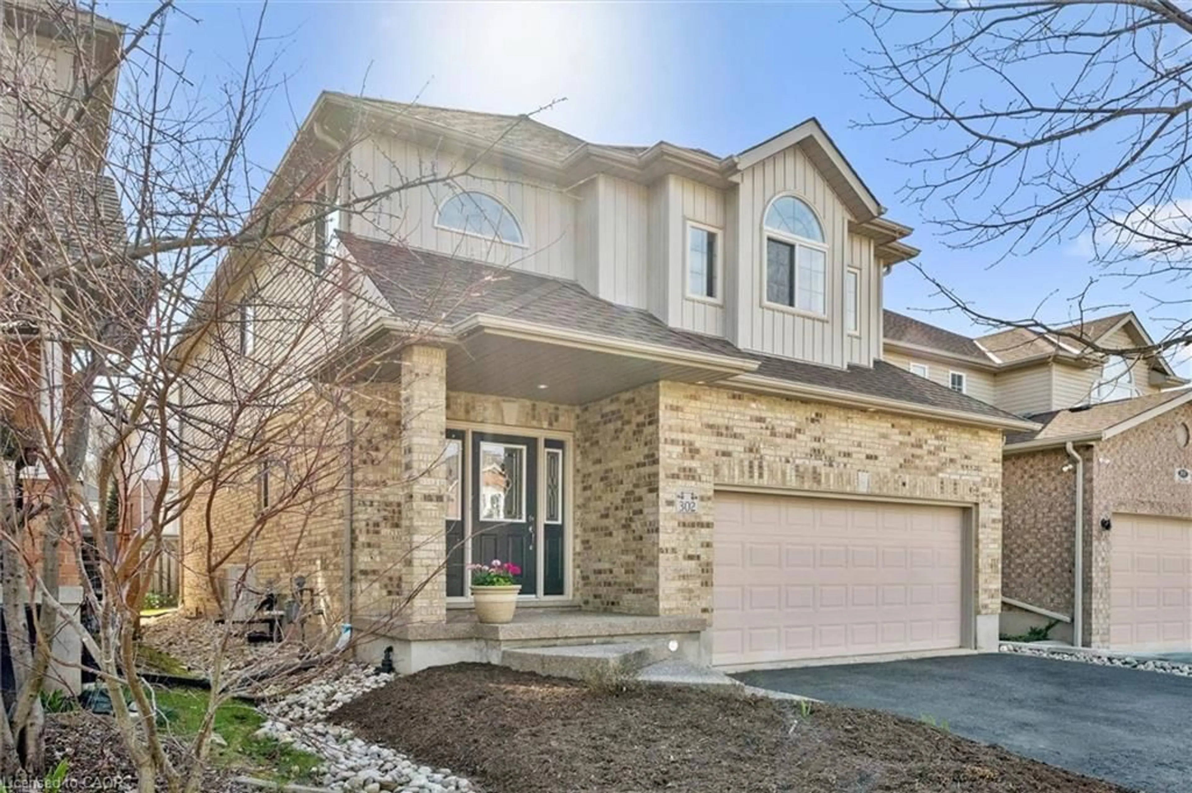 Home with brick exterior material, street for 302 Red Osier Rd, Waterloo Ontario N2V 2V7