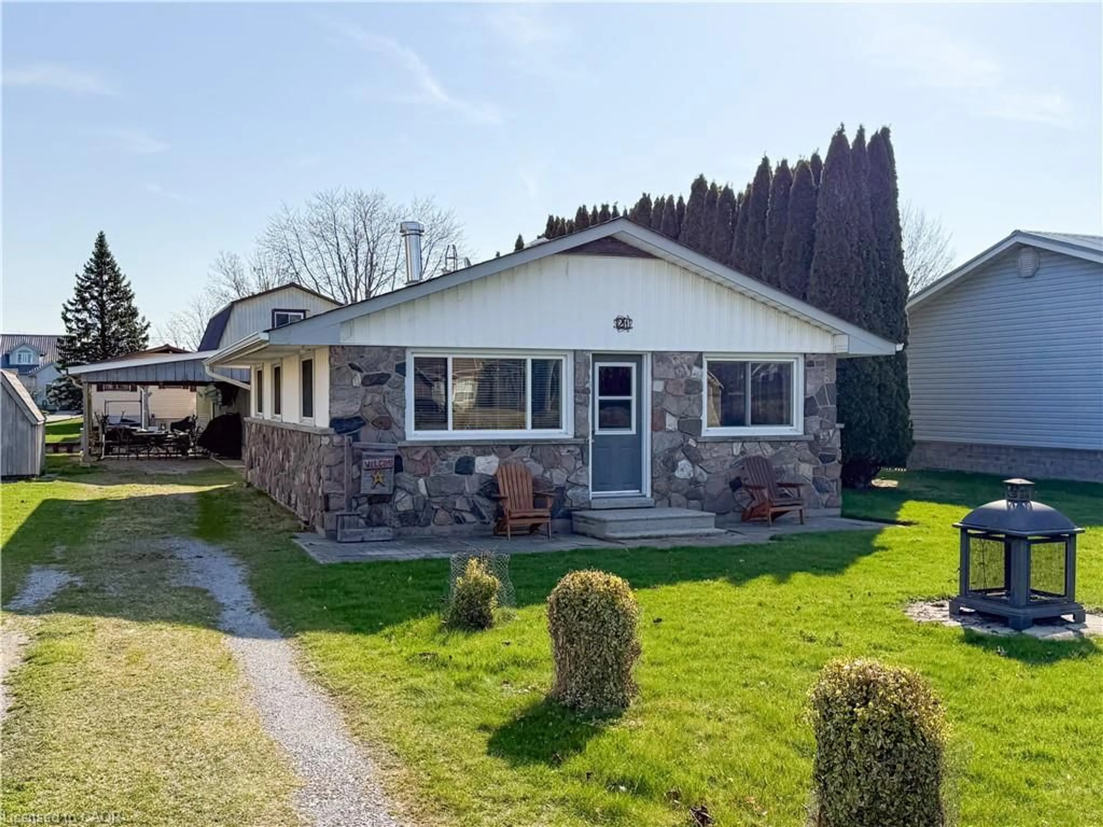 Home with vinyl exterior material, street for 21 Poplar Rd, Long Point Ontario N0E 1M0