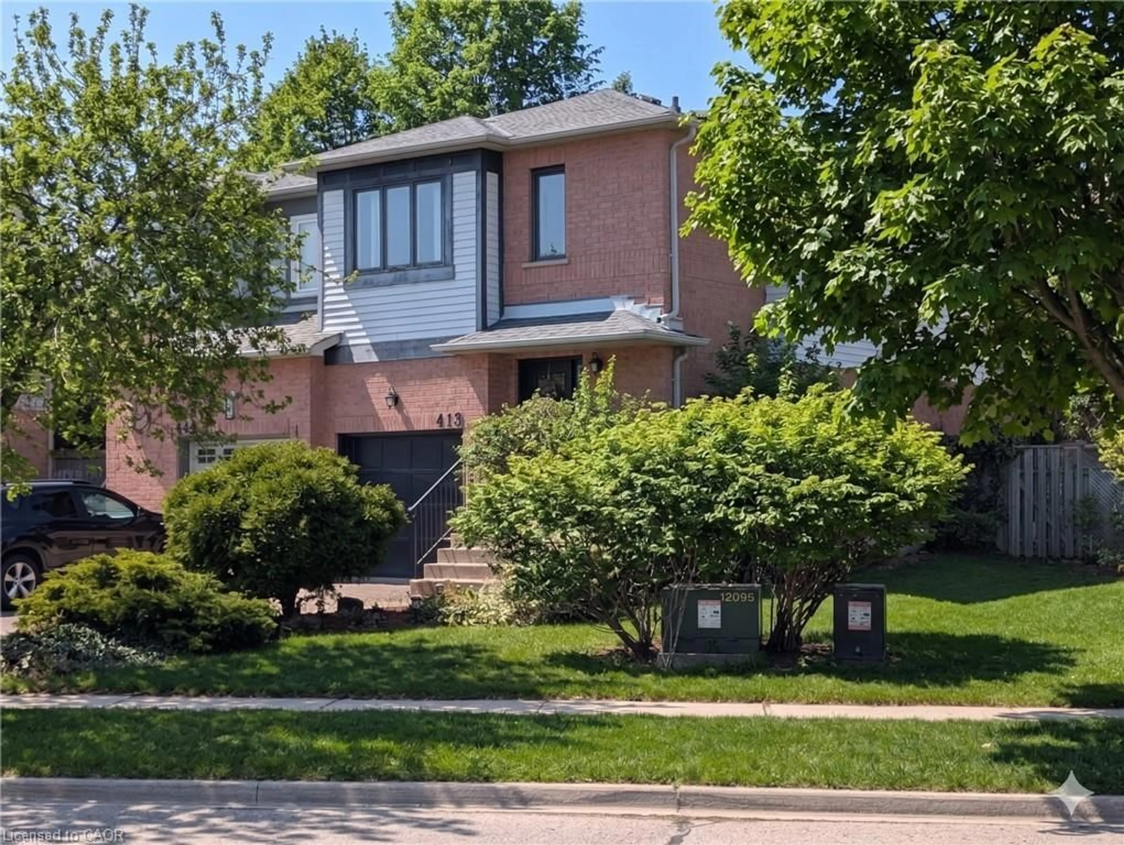 Home with brick exterior material, street for 413 Levanna Lane, Oakville Ontario L6H 6B8