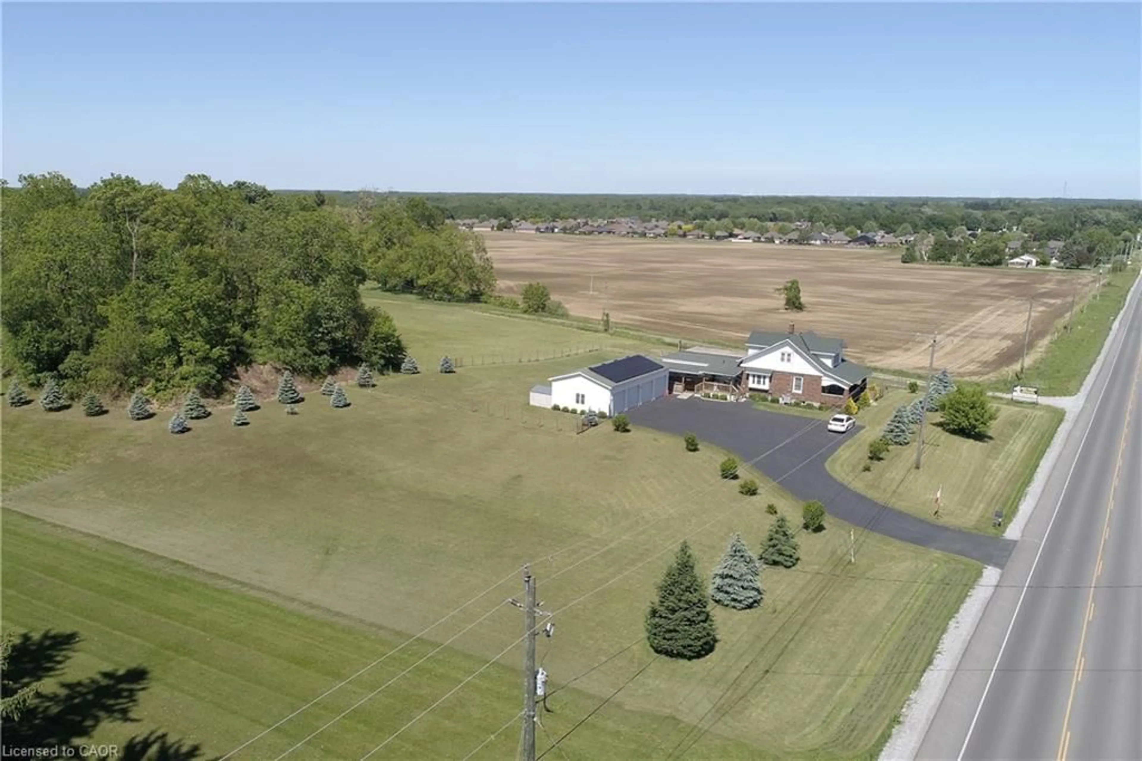 A pic from outside/outdoor area/front of a property/back of a property/a pic from drone, water/lake/river/ocean view for 589 Highway 6, Port Dover Ontario N0A 1N2