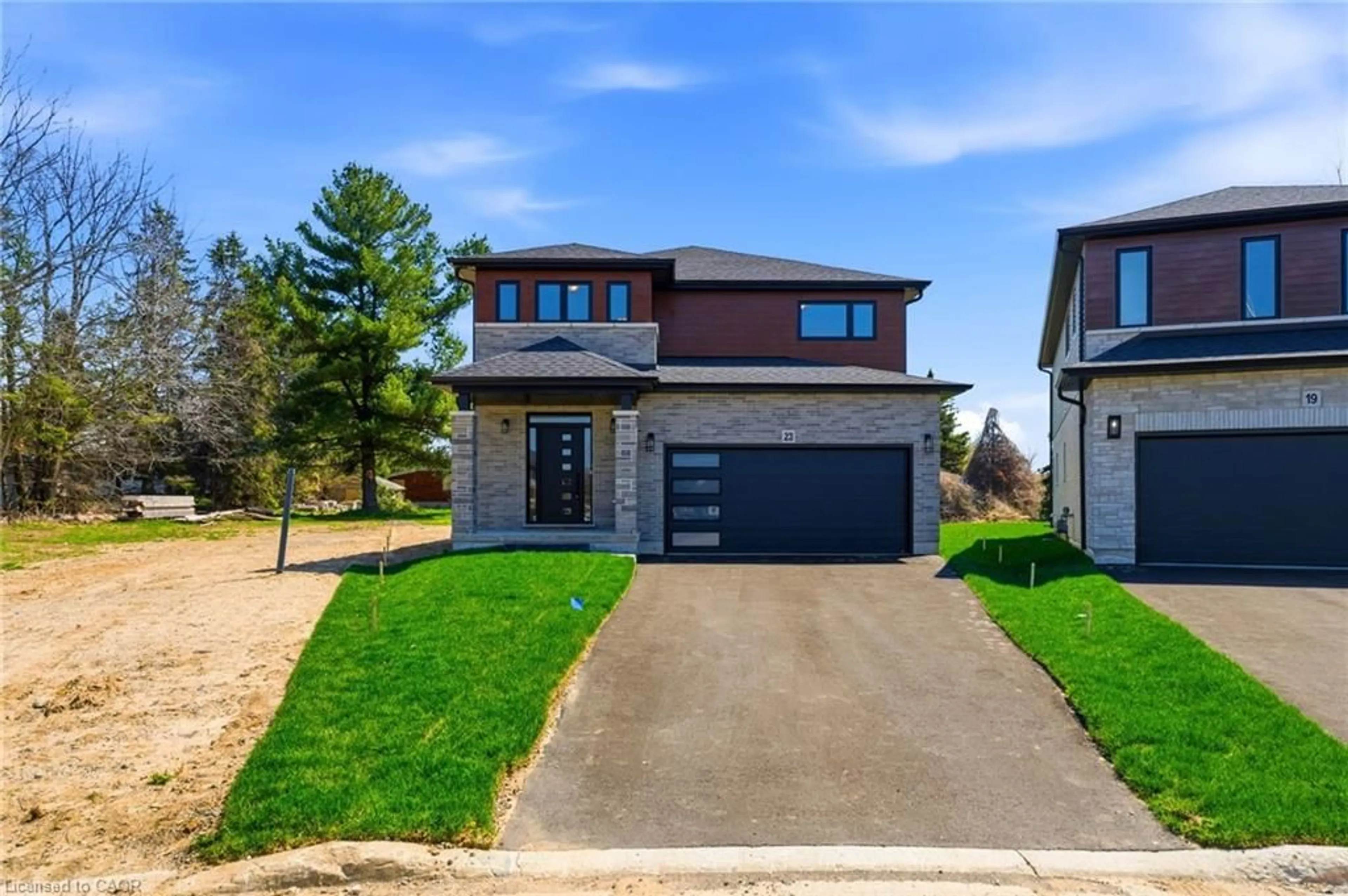 Home with brick exterior material, street for 23 Woodvalley Crt, Hamilton Ontario L9B 2S7