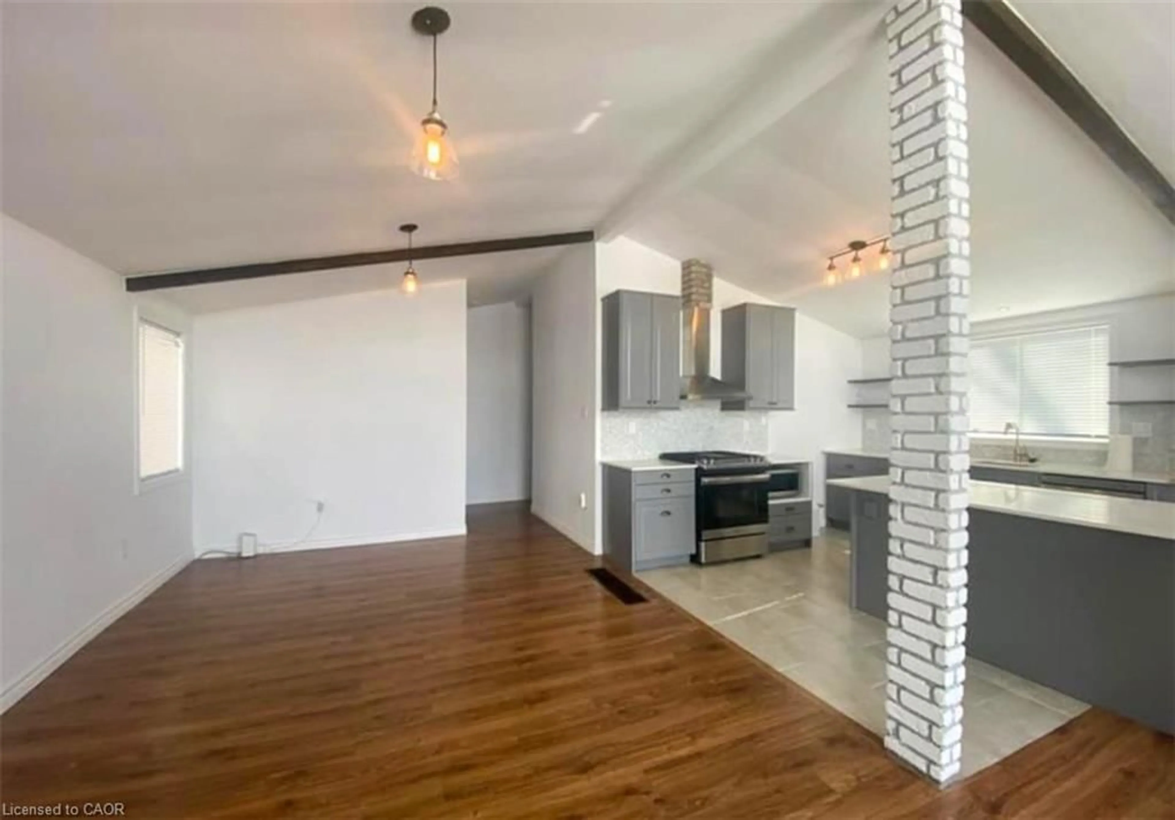 Open concept kitchen, wood/laminate floor for 61 Cedar St, Paris Ontario N3L 0A1