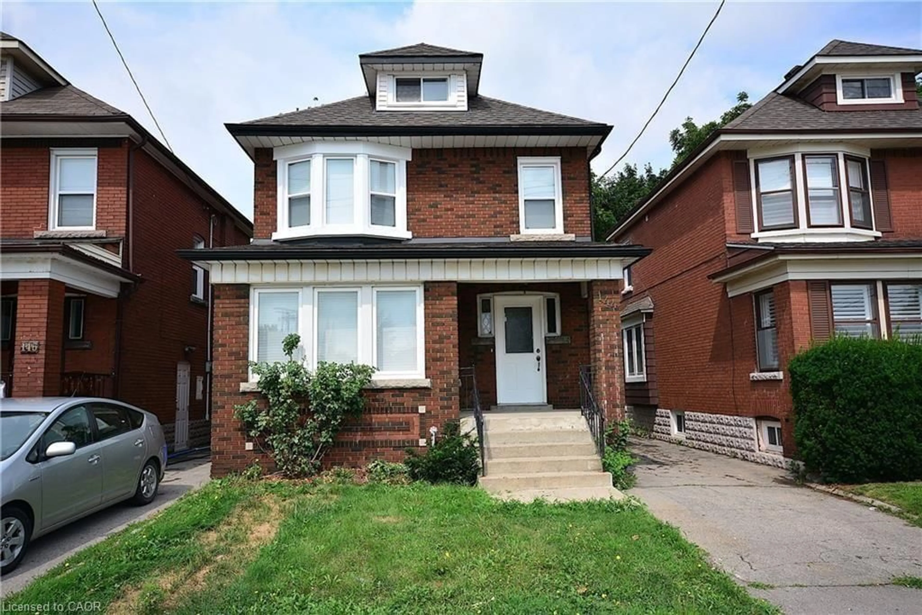 Home with brick exterior material, street for 144 Ottawa St, Hamilton Ontario L8K 2E4