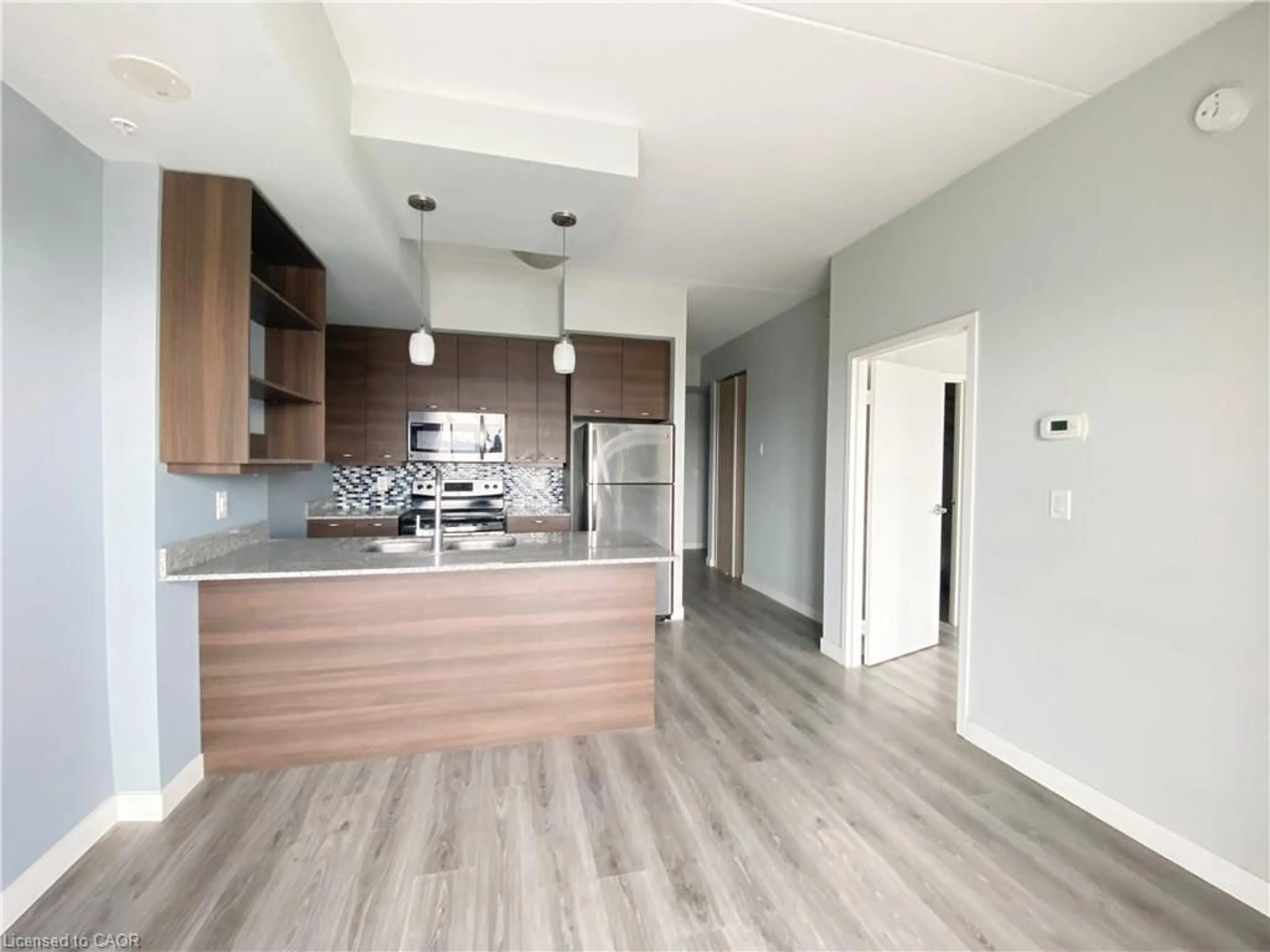 Open concept kitchen, wood/laminate floor for 318 Spruce St #1501, Waterloo Ontario N2L 0E9