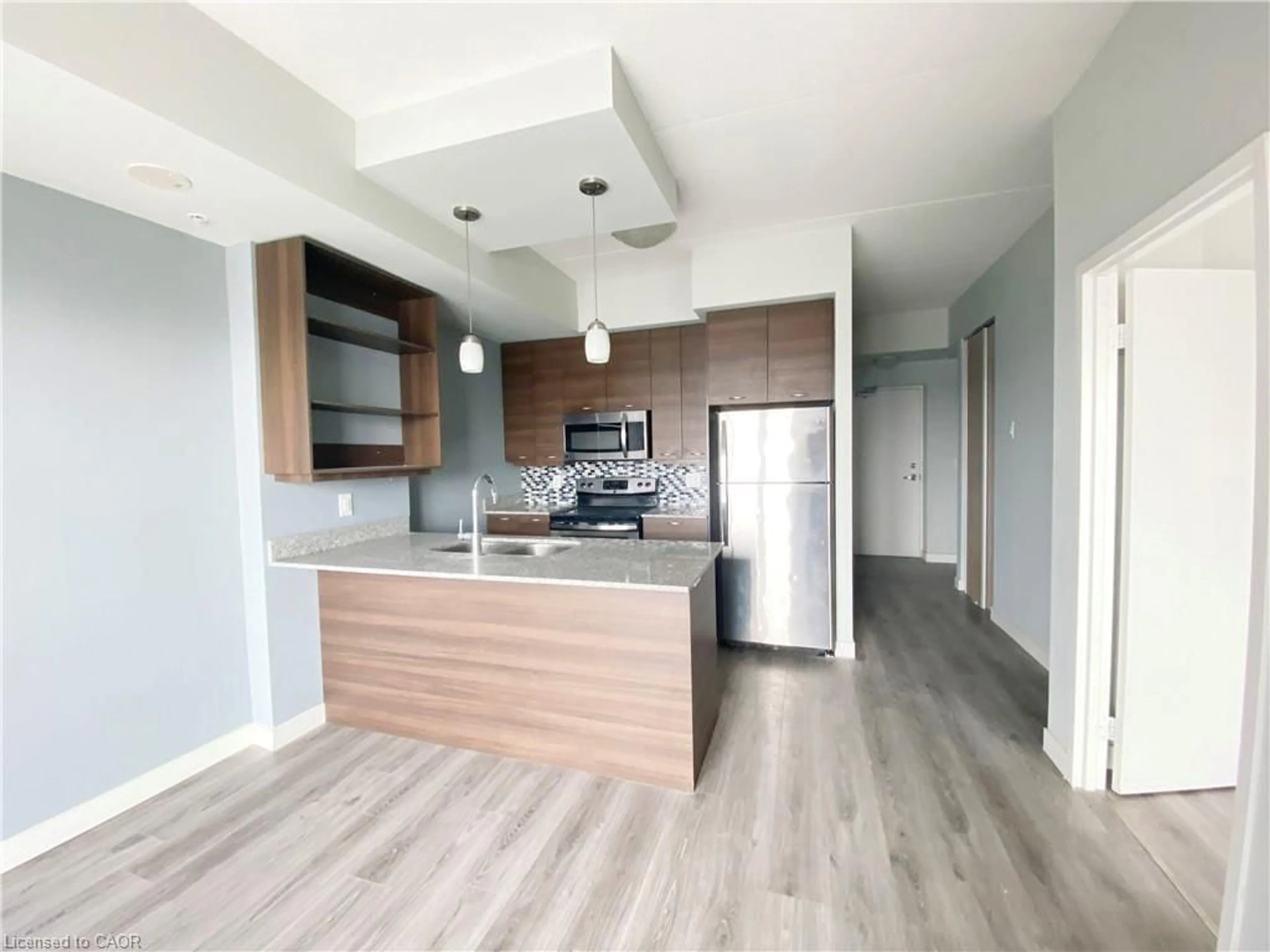 Open concept kitchen, wood/laminate floor for 318 Spruce St #1501, Waterloo Ontario N2L 0E9