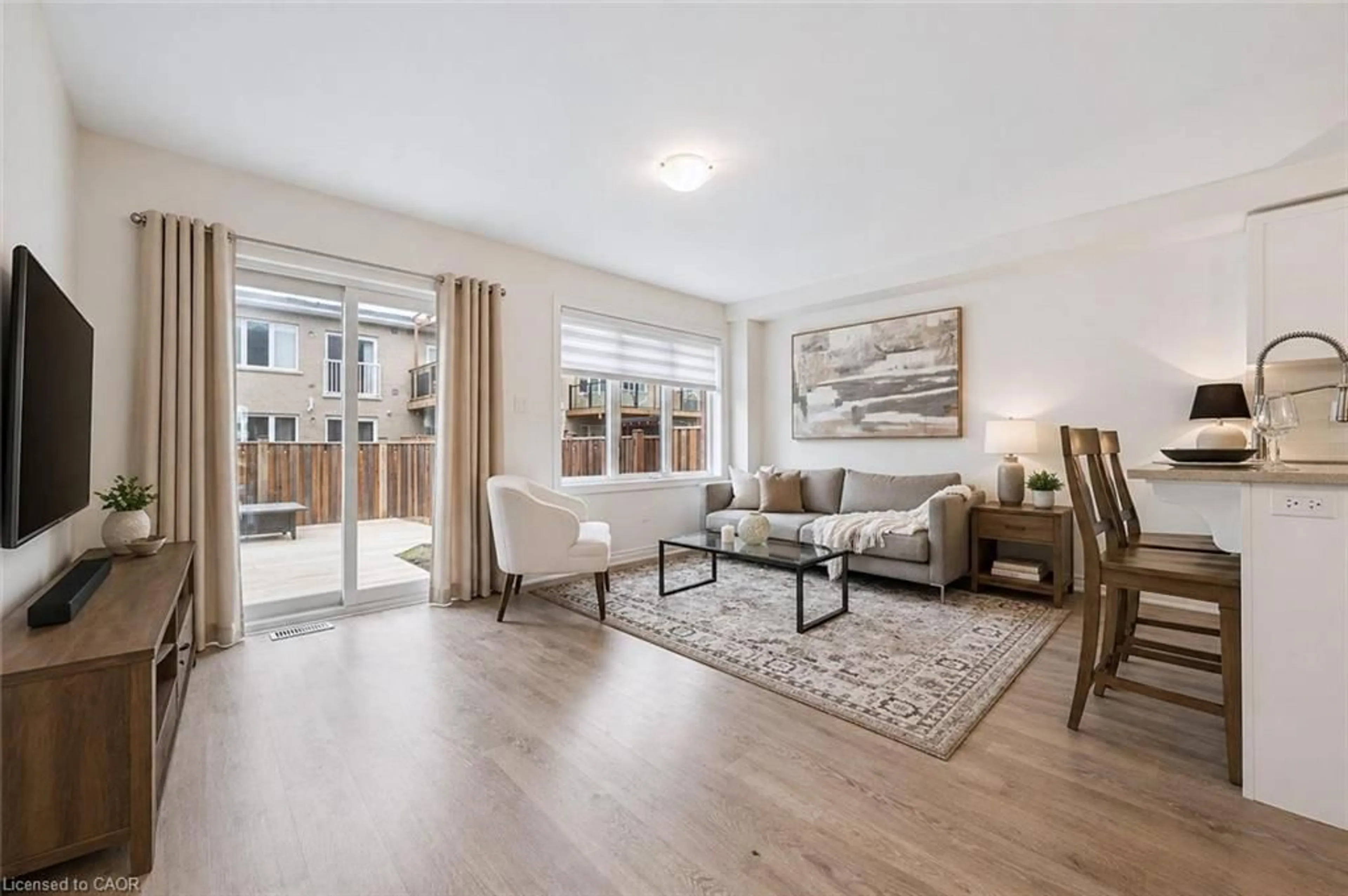 Living room with furniture, wood/laminate floor for 26 Skinner Dr, Guelph Ontario N1E 0P7