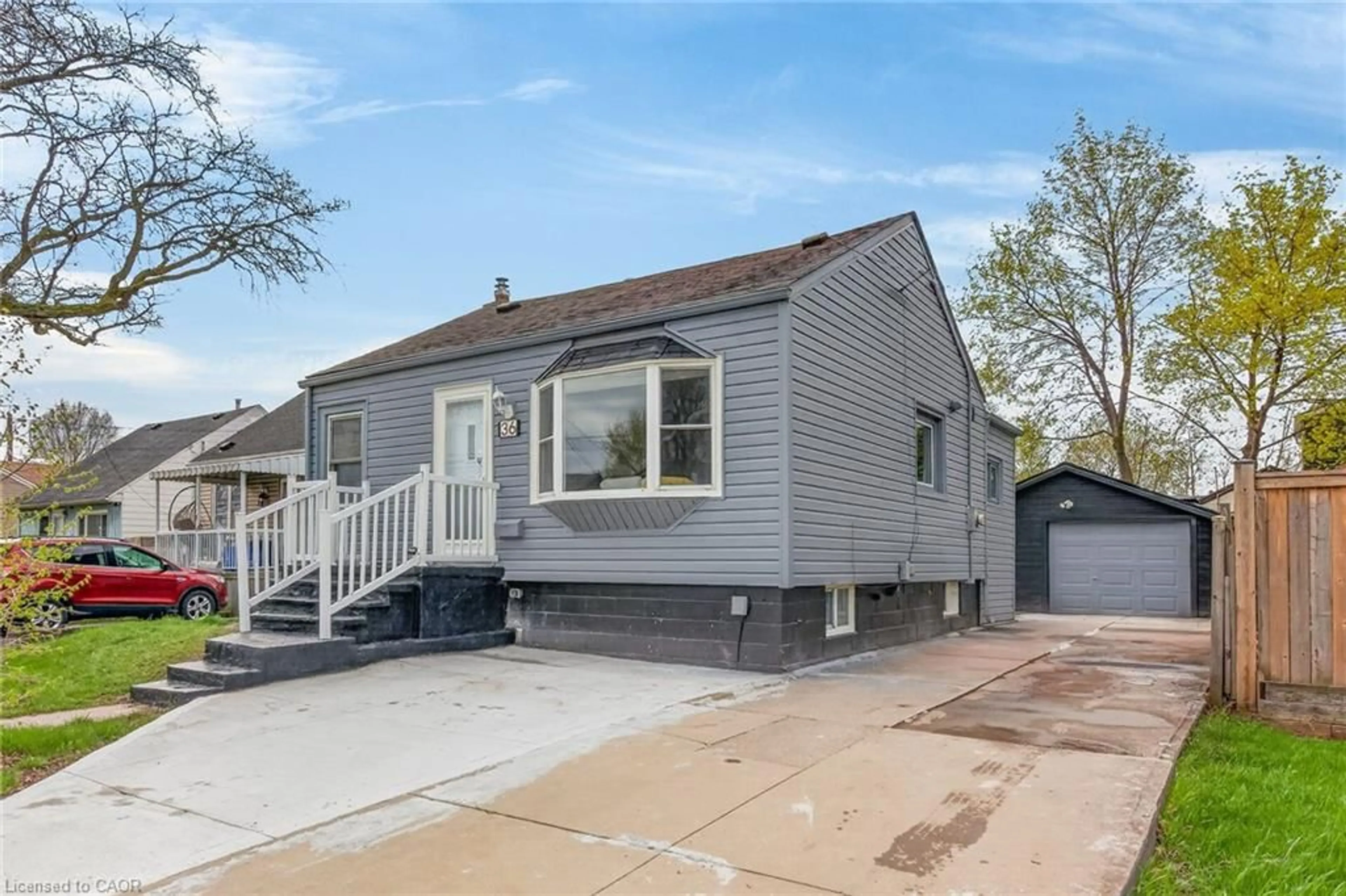 Home with vinyl exterior material, street for 36 Mahony Ave, Hamilton Ontario L8H 3C5