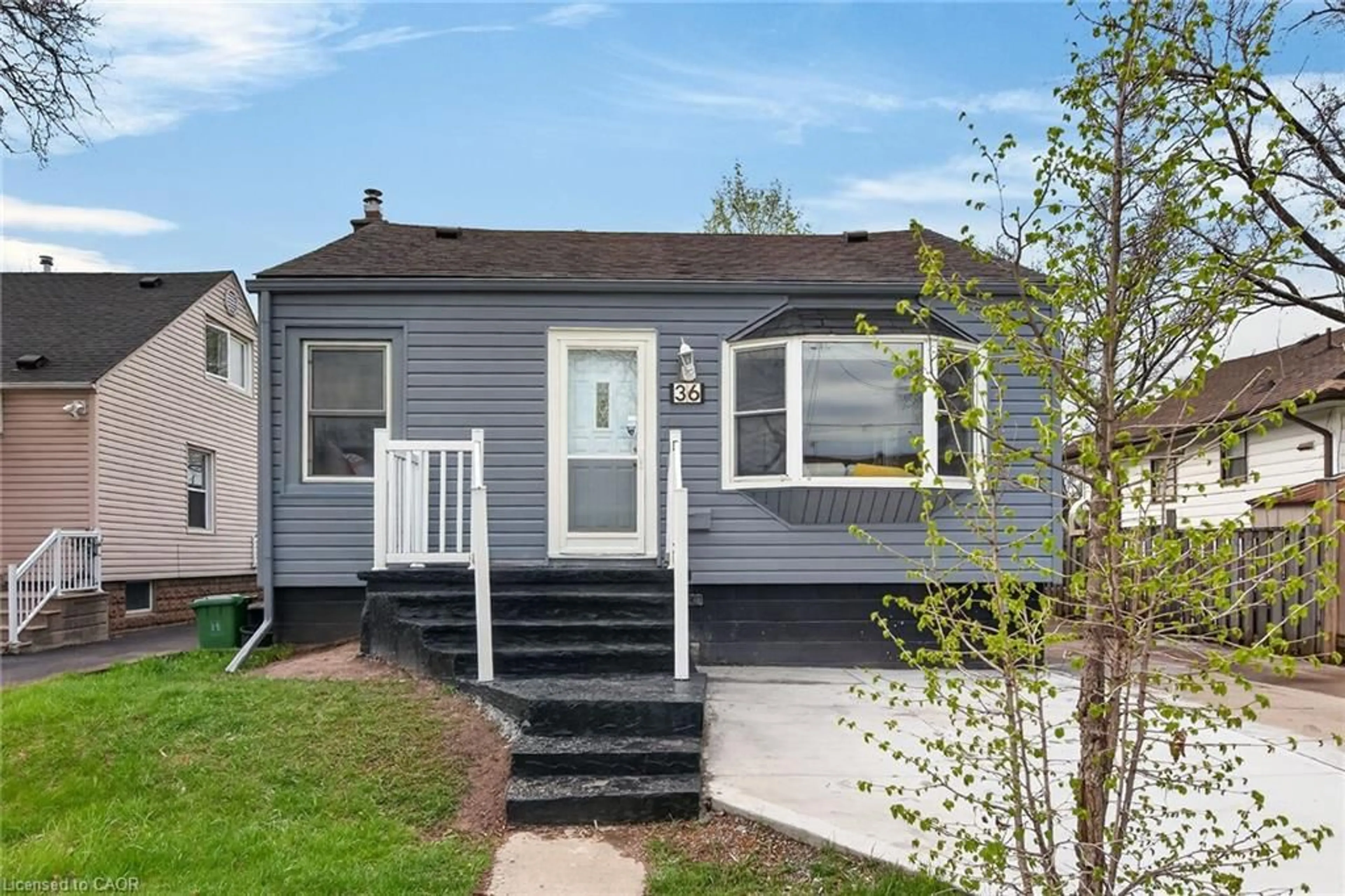 Home with vinyl exterior material, street for 36 Mahony Ave, Hamilton Ontario L8H 3C5