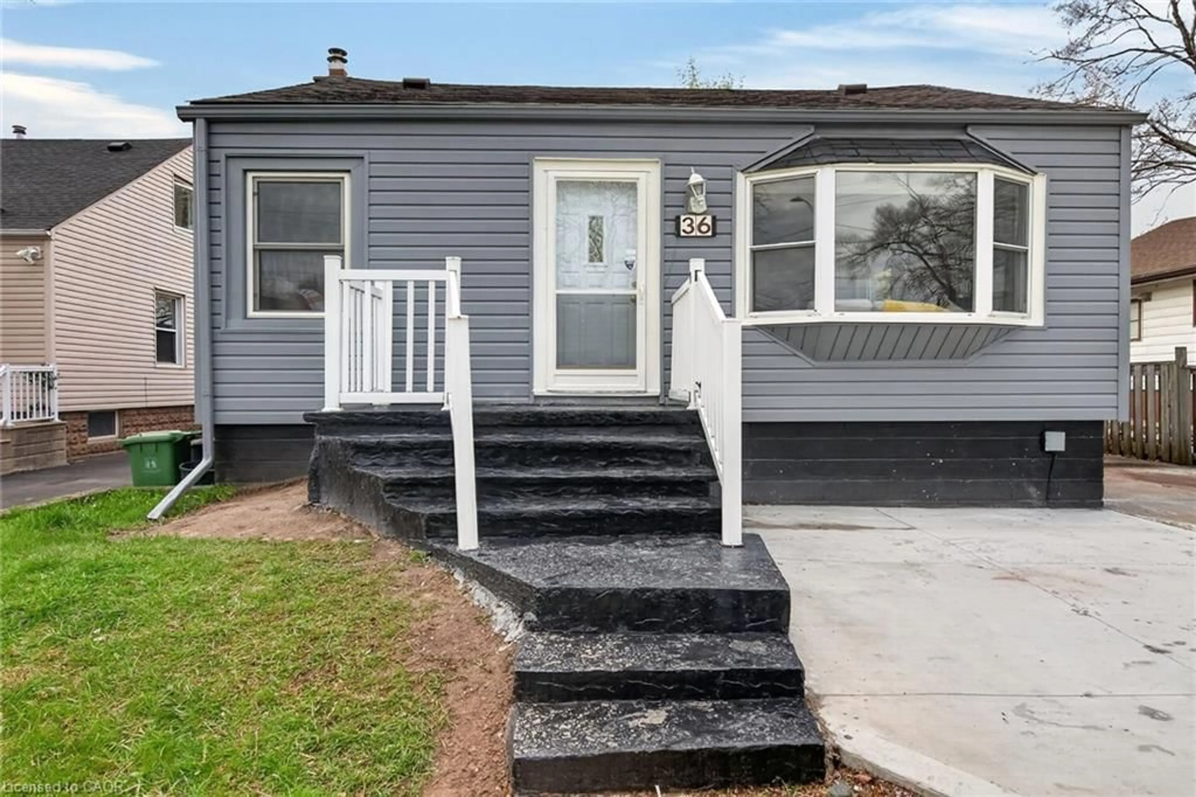 Home with vinyl exterior material, street for 36 Mahony Ave, Hamilton Ontario L8H 3C5