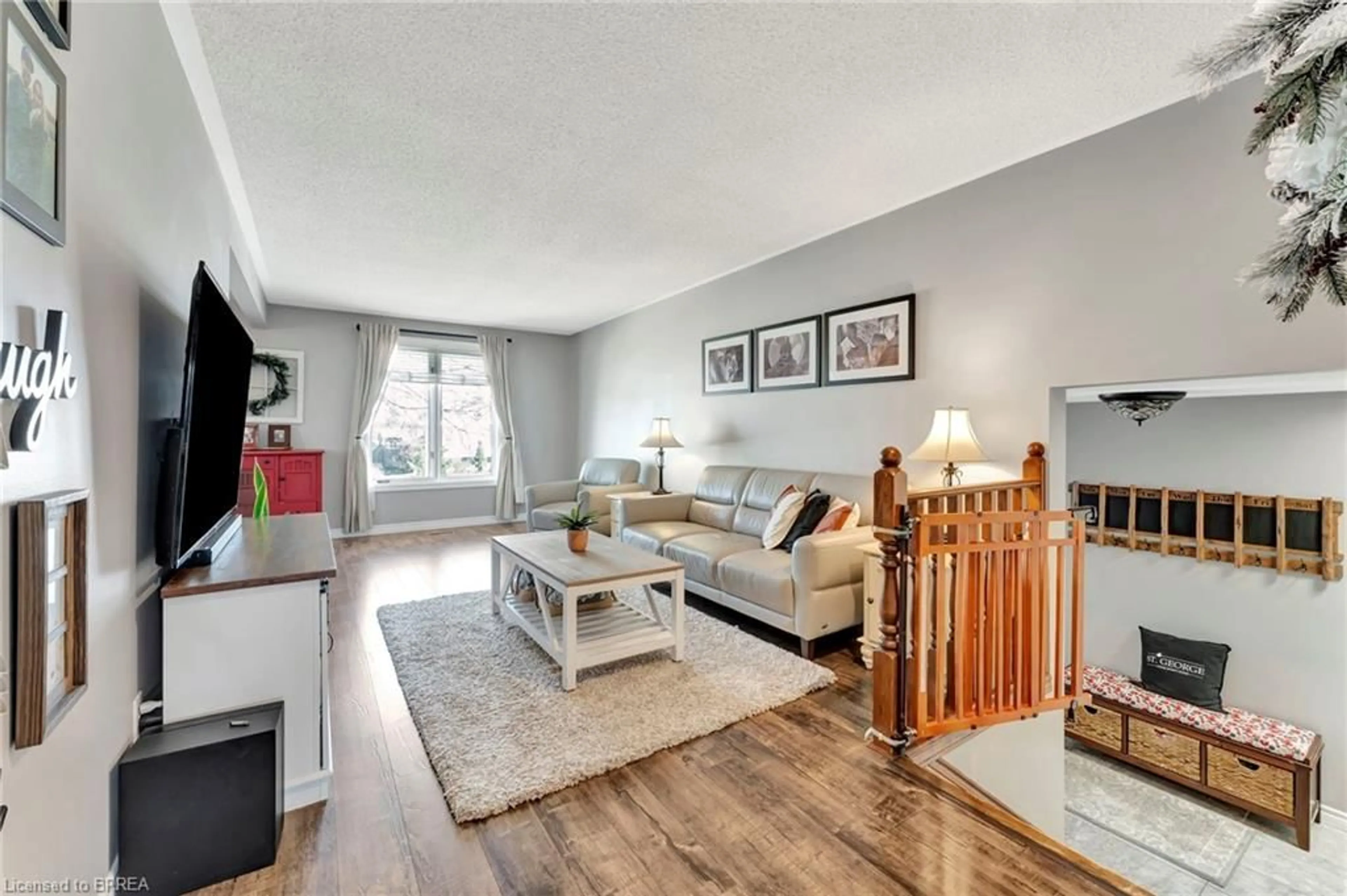 Living room with furniture, wood/laminate floor for 21 Scott St, St. George Ontario N0E 1N0