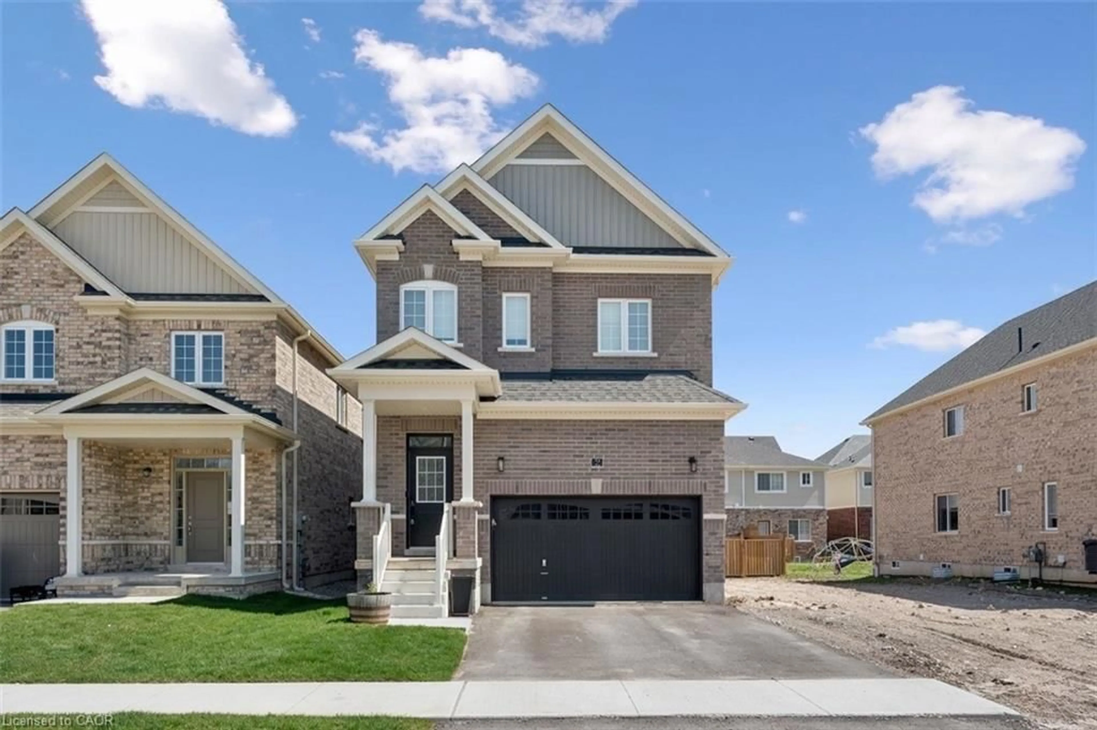 Home with brick exterior material, street for 32 Hutchison Rd, Guelph Ontario N1L 0R4
