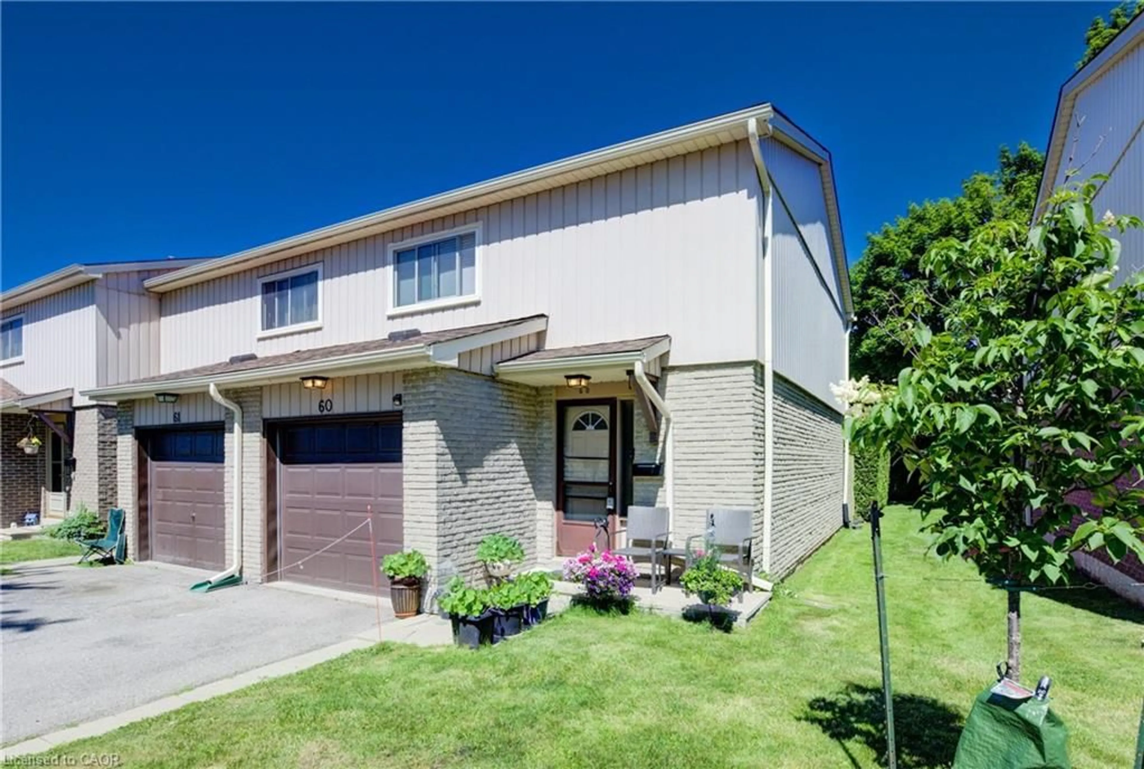 Home with brick exterior material, street for 51 Paulander Dr #60, Kitchener Ontario N2M 5E5