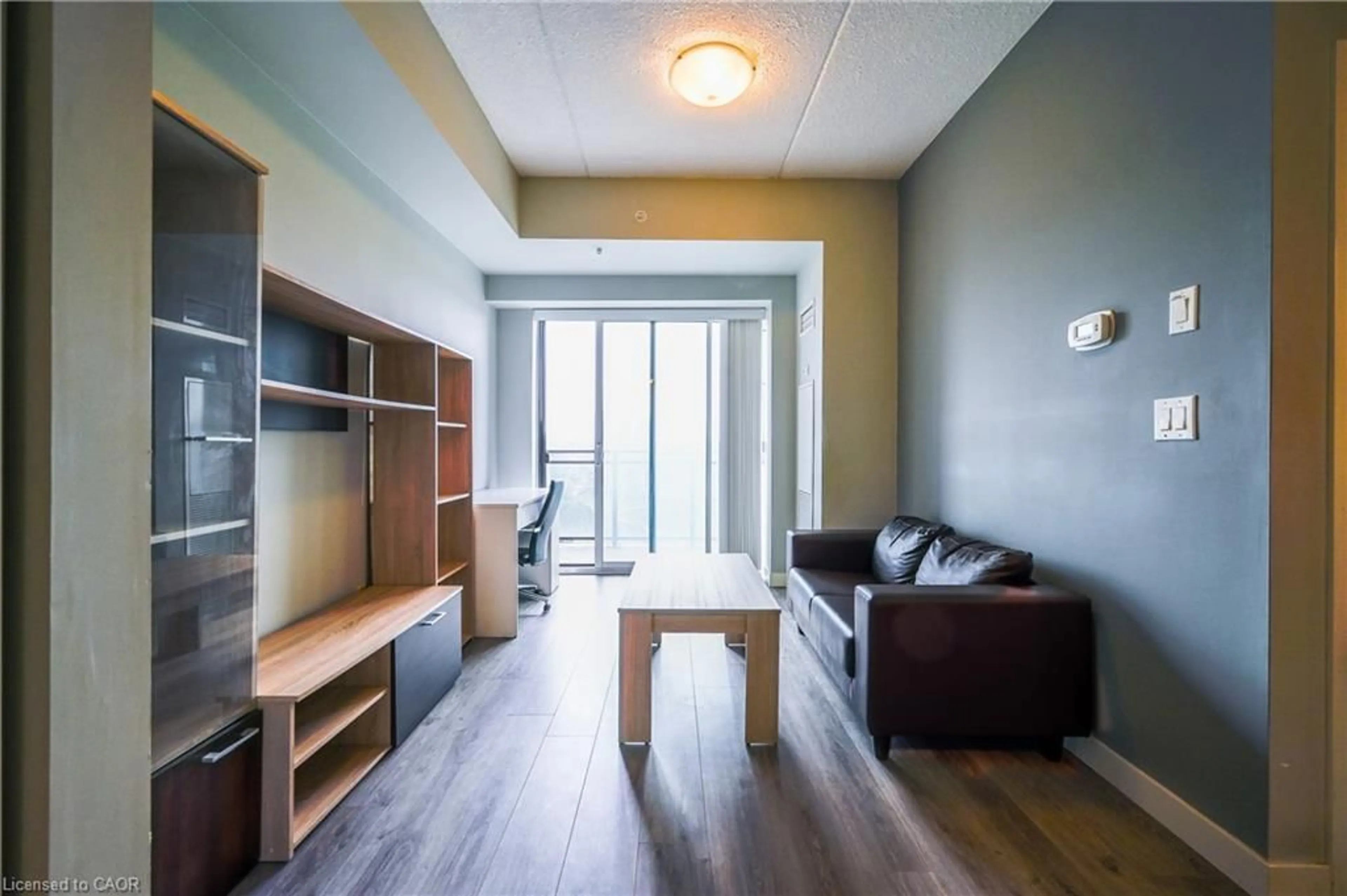 Living room with furniture, wood/laminate floor for 318 Spruce St #1009, Waterloo Ontario N2L 3M7
