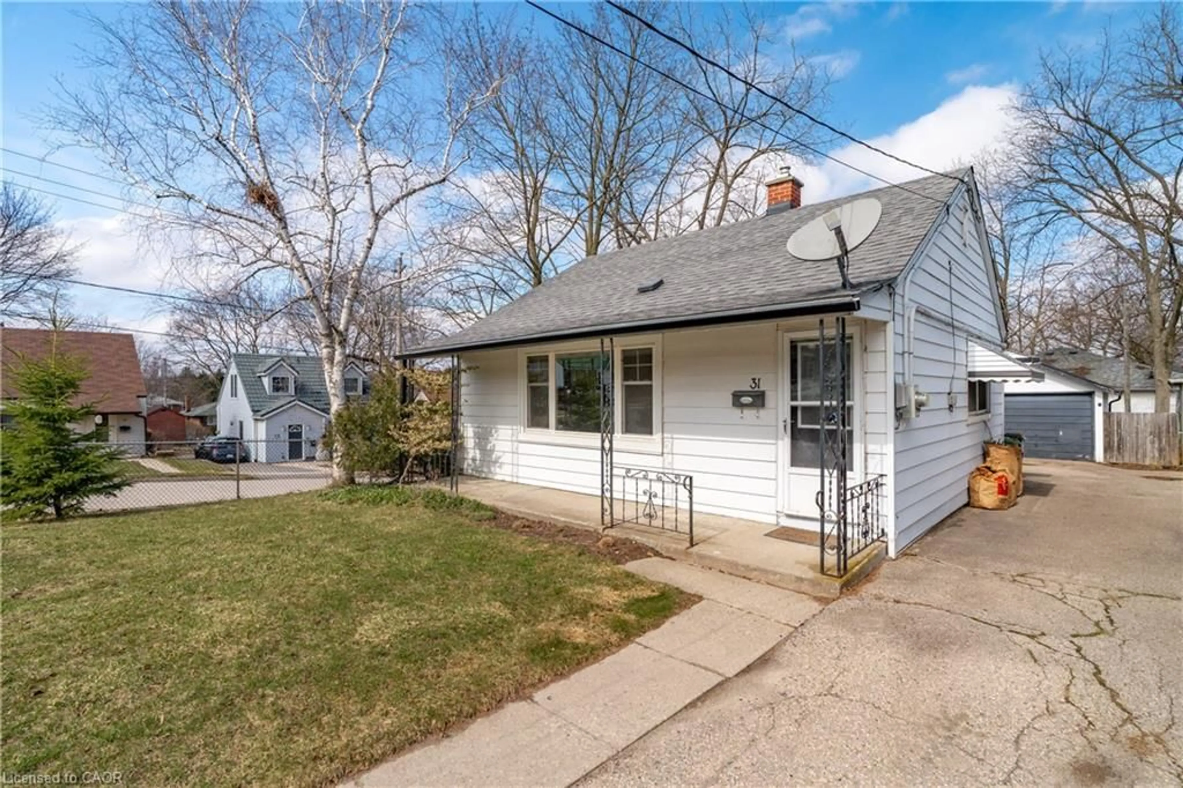 Home with vinyl exterior material, street for 31 Dunkirk St, Guelph Ontario N1E 4N7