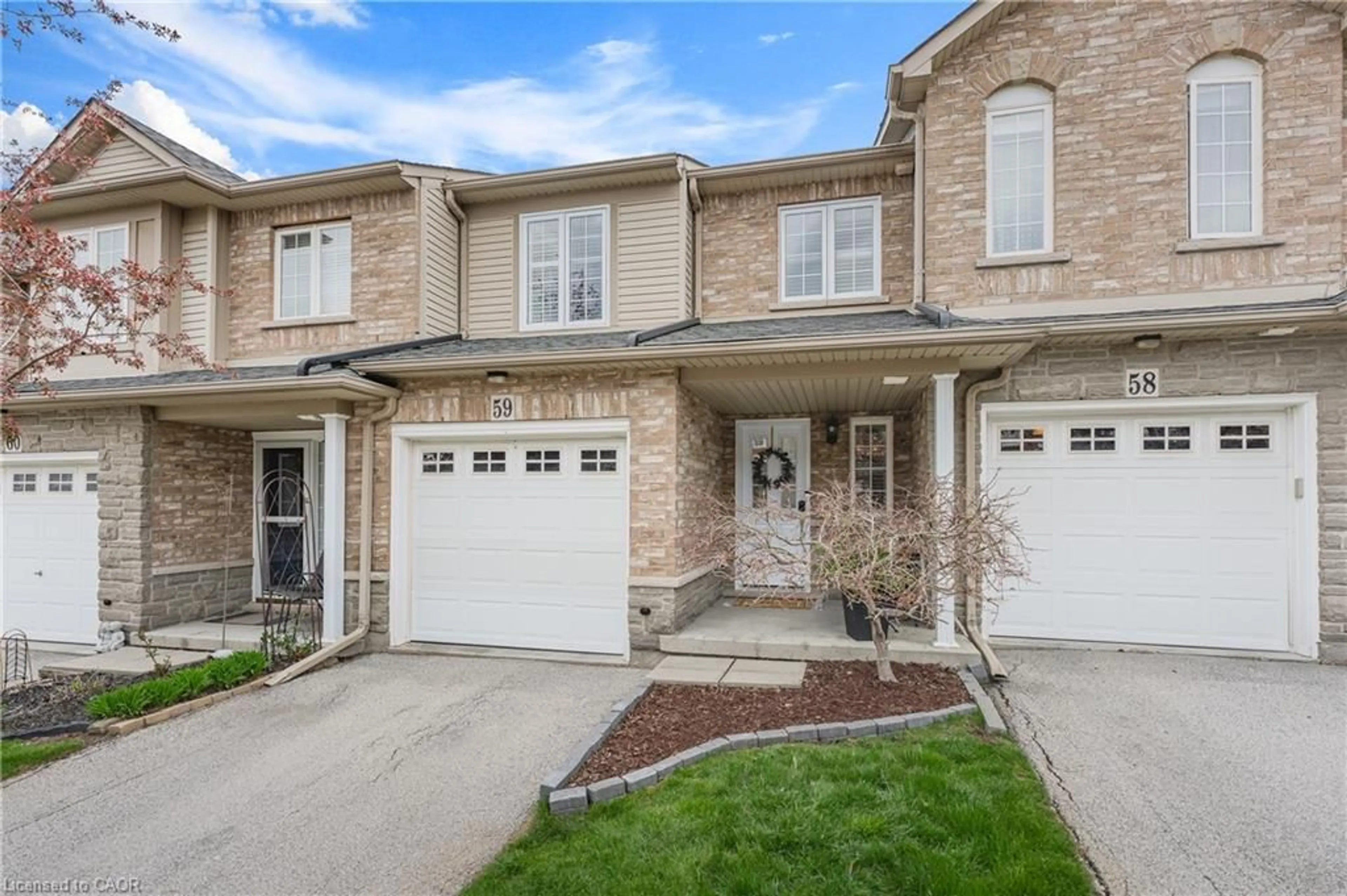 Home with brick exterior material, street for 7 Southside Pl #59, Hamilton Ontario L9C 7W6
