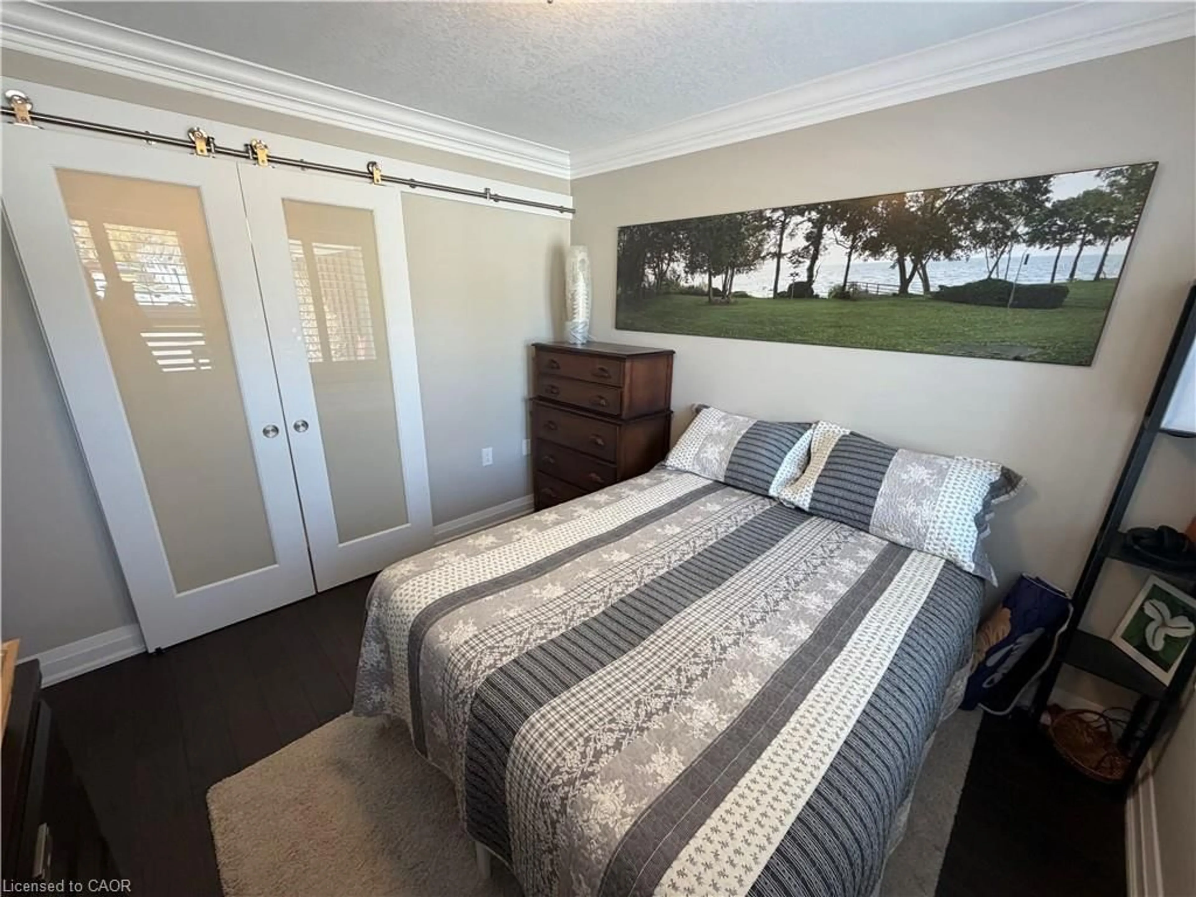 Bedroom with bed, wood/laminate floor for 31 Bishop Tonnos Way, Hamilton Ontario L9B 2L7
