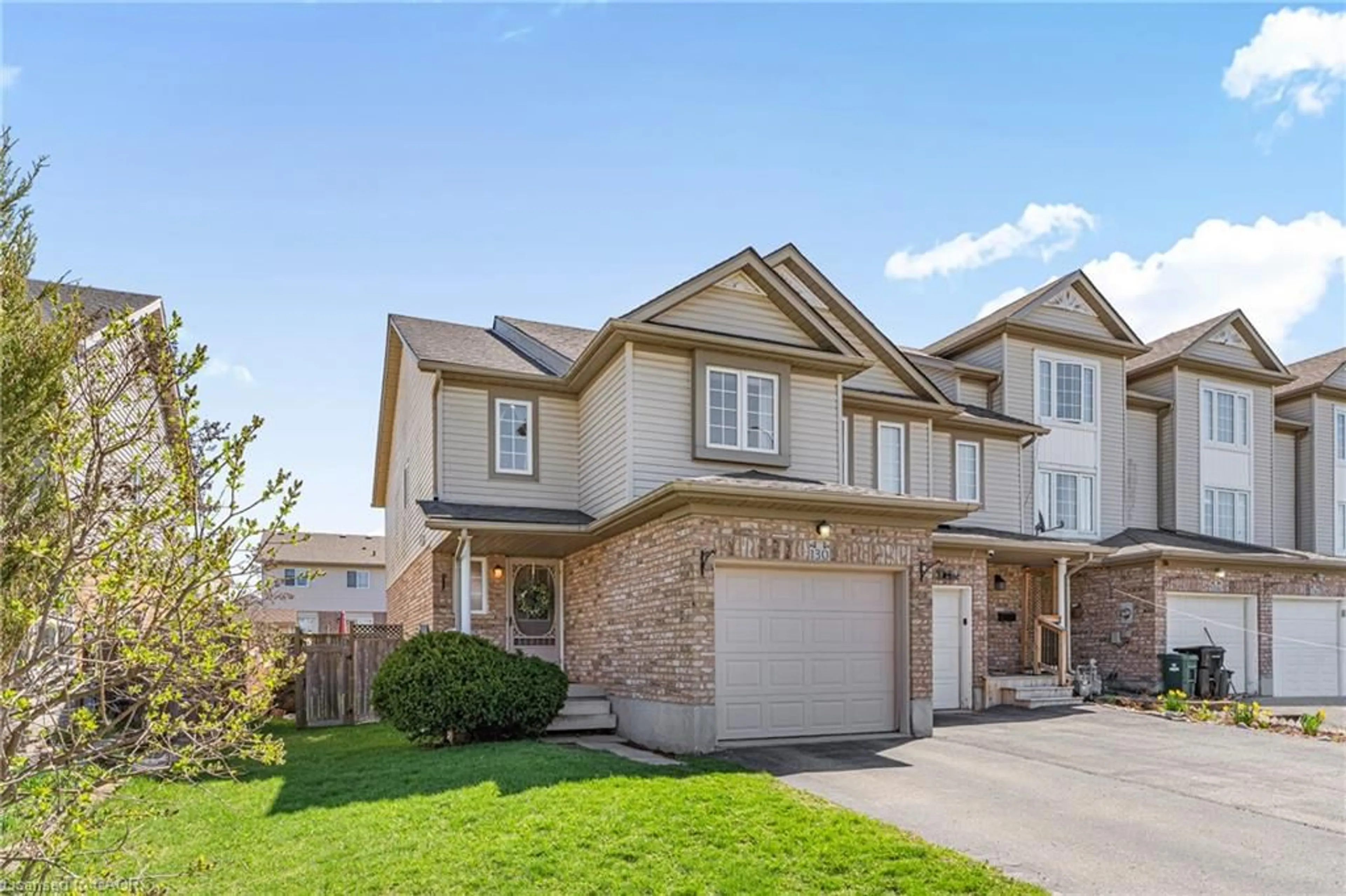 Home with brick exterior material, street for 130 Donnenwerth Dr, Kitchener Ontario N2E 4C8